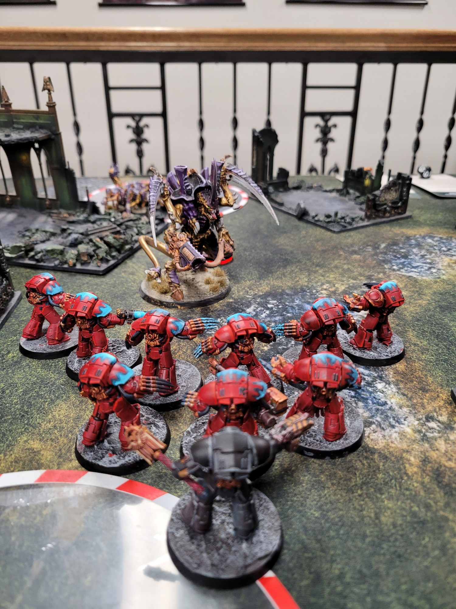 10 Assault terminators and a chaplain facing down a Hive Tyrant