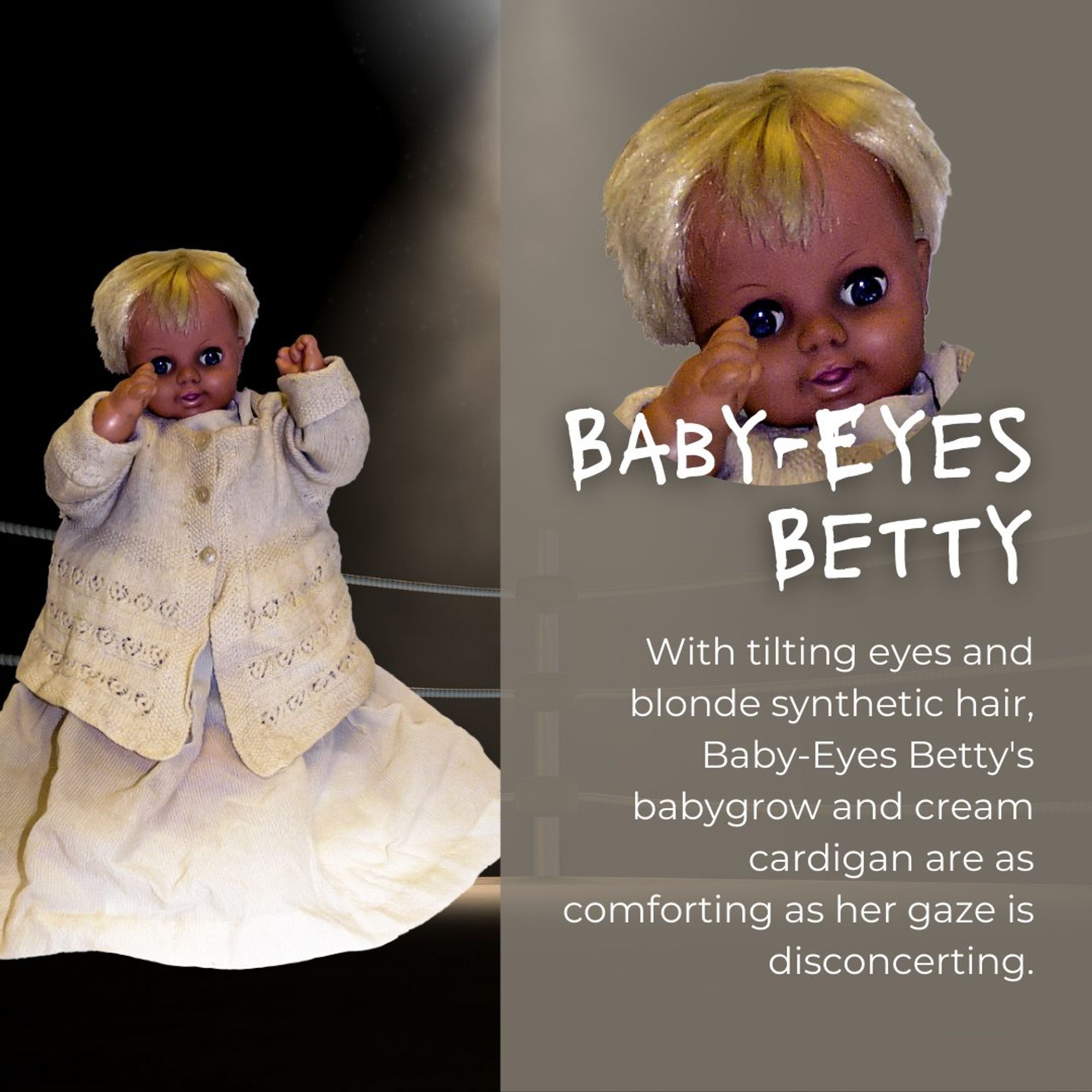 Baby-Eyes Betty: A dark-skinned baby doll with large tilting eyes and synthetic blonde hair. She wears a cream-coloured cardigan over a matching baby grow. Her unnervingly wide-eyed stare contrasts with the cosy appearance of her clothing.