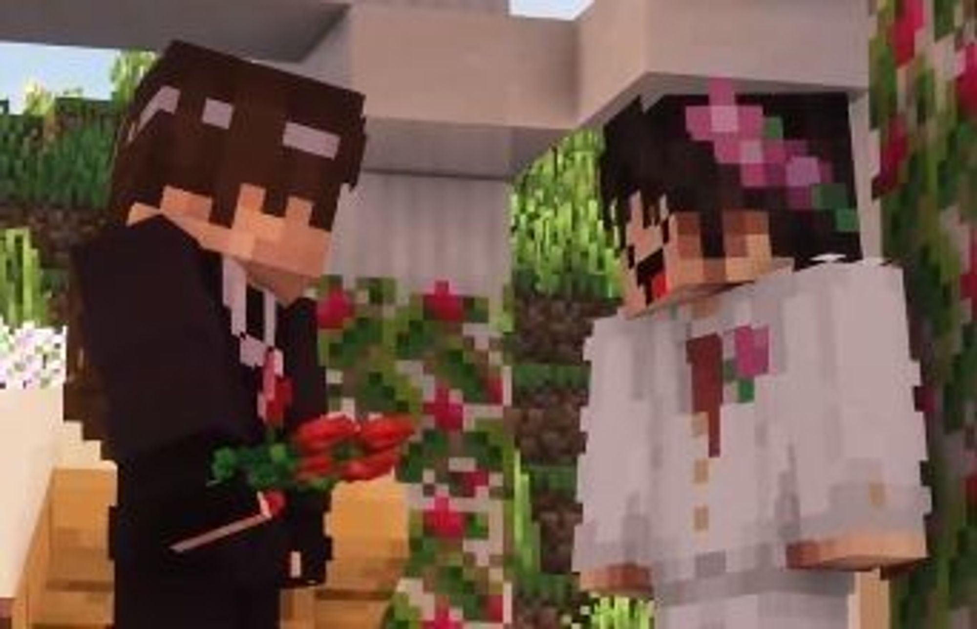 Casamento de Roier e Cellbit no QSMP. Cellbit está do lado esquerdo segurando uma flor e Roier está do lado direito, ambos se olhando