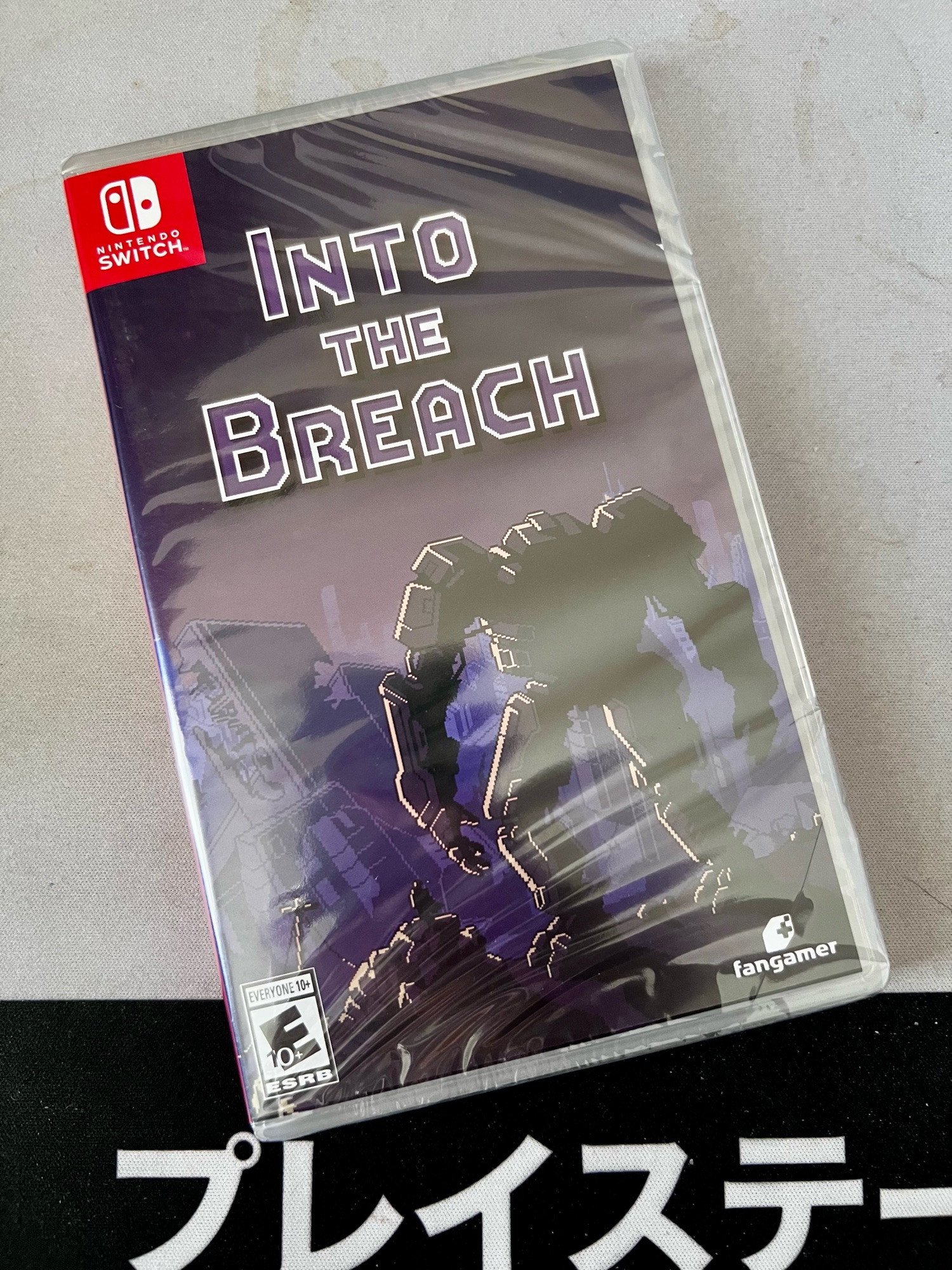 a shrink-wrapped Into the Breach for Nintendo Switch. it’s the Fangamer edition 