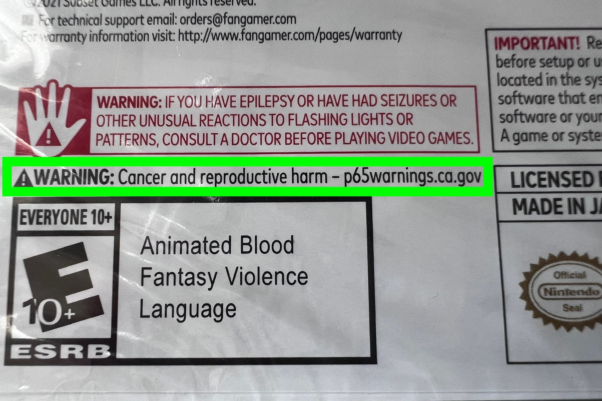 back of the game. lots of text, with the following in a green rectangle: WARNING: Cancer and reproductive harm – p65warnings.ca.gov