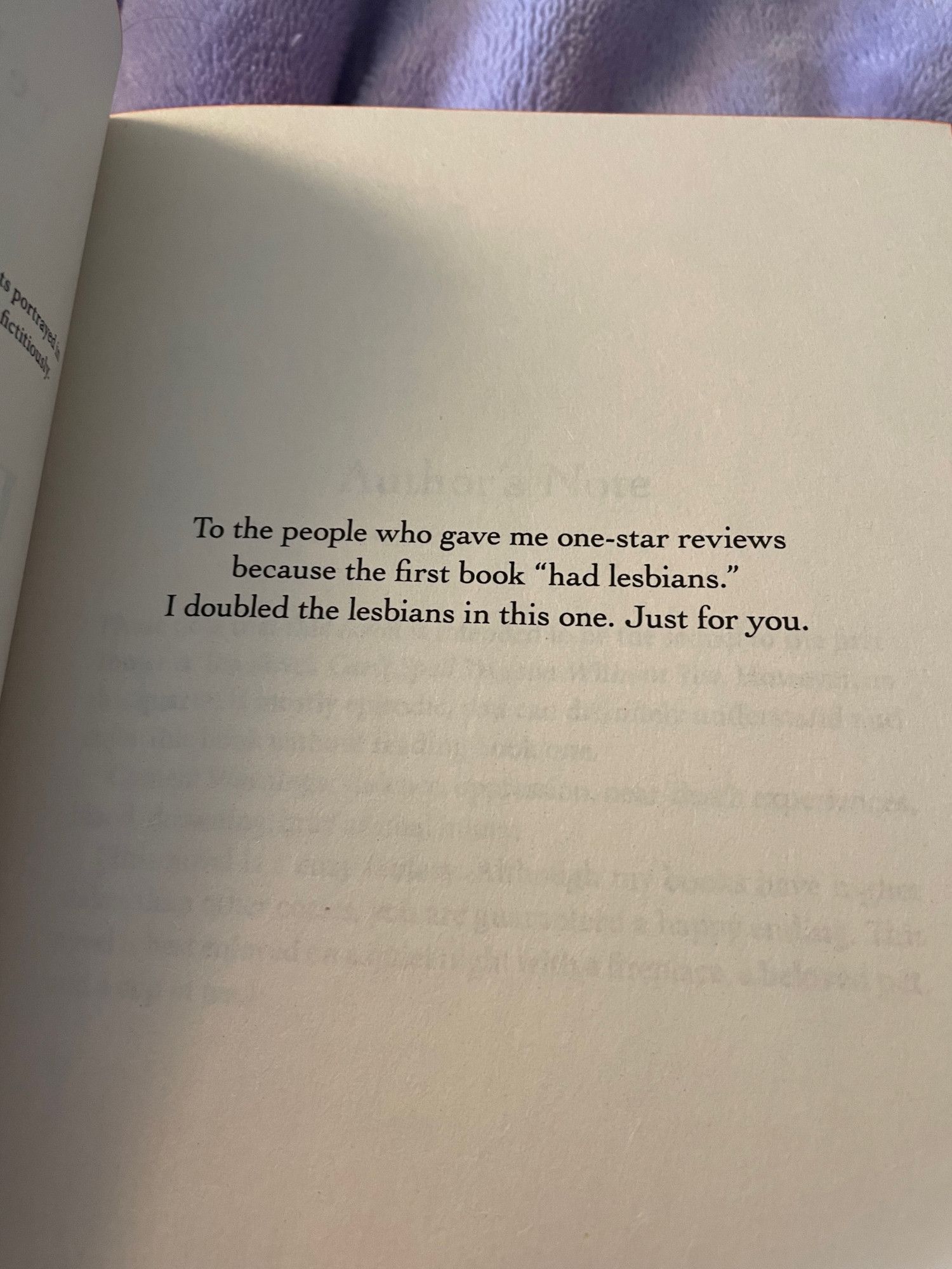 The dedication at the front of the book reads: To the people who gave me one-star reviews because the first book "had lesbians." I doubled the lesbians in this one. Just for you.