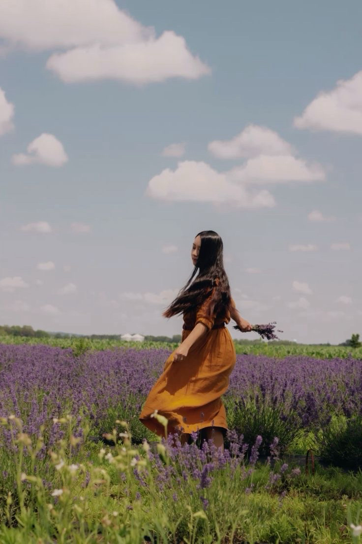 A girl twirling at the lavender farm.