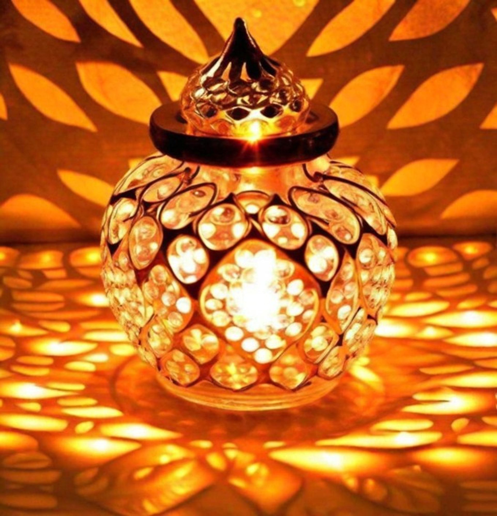 The Collectible India Akhand Diya is a staggering piece of craftsmanship, mixing customary plan with contemporary polish. Made from metal and enhanced with impeccable gem embellishments, this oil light transmits immortal appeal. Its oval shape and perplexing enumerating make it an ideal option to Diwali festivities, adding a hint of quality to any home style. Whether utilized as a puja light or tea light holder, it enlightens spaces with warmth and effortlessness, making it an optimal gift for Diwali or any extraordinary event.