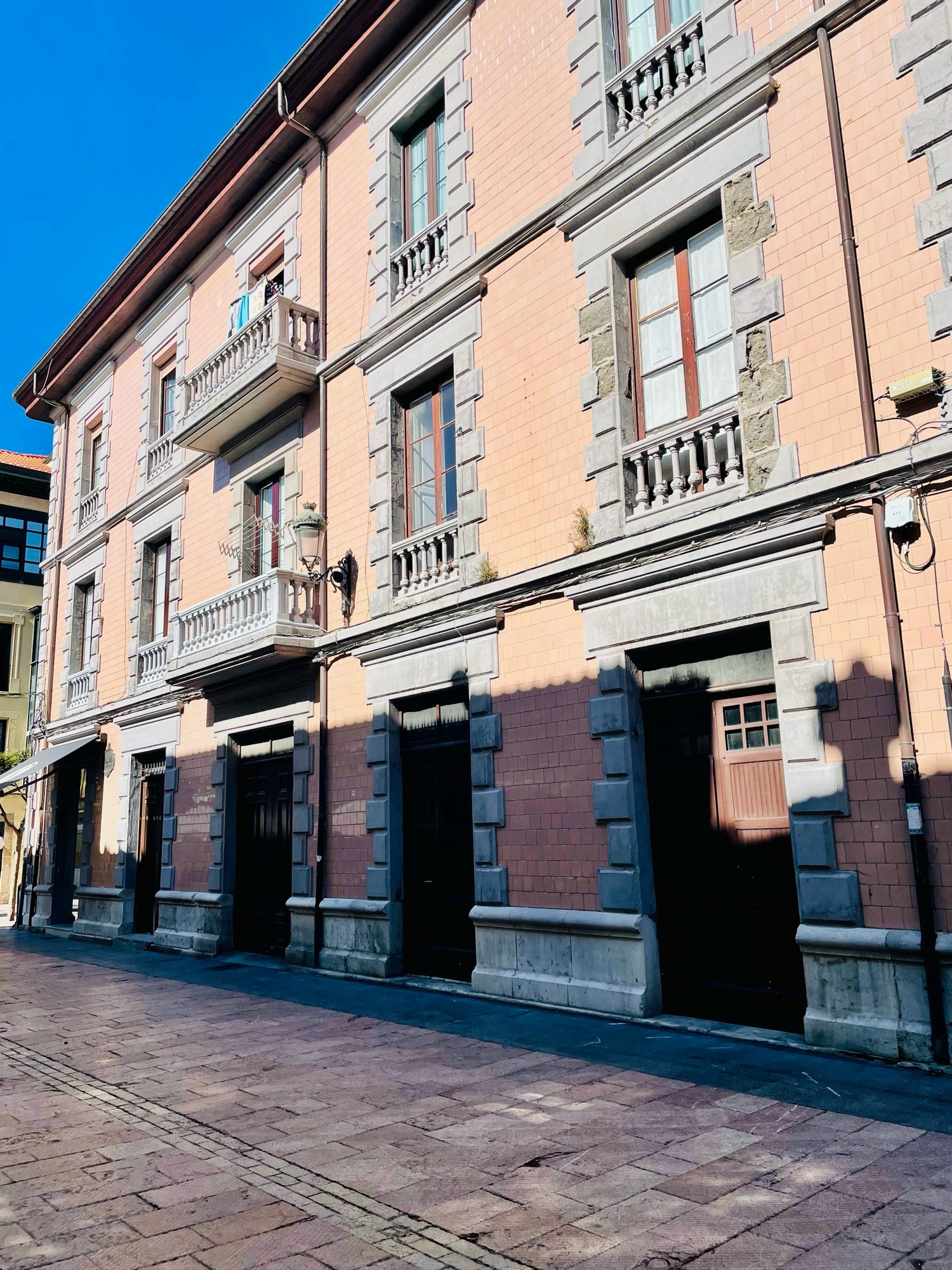 Peach coloured building with grey trim in the Old Quarter.