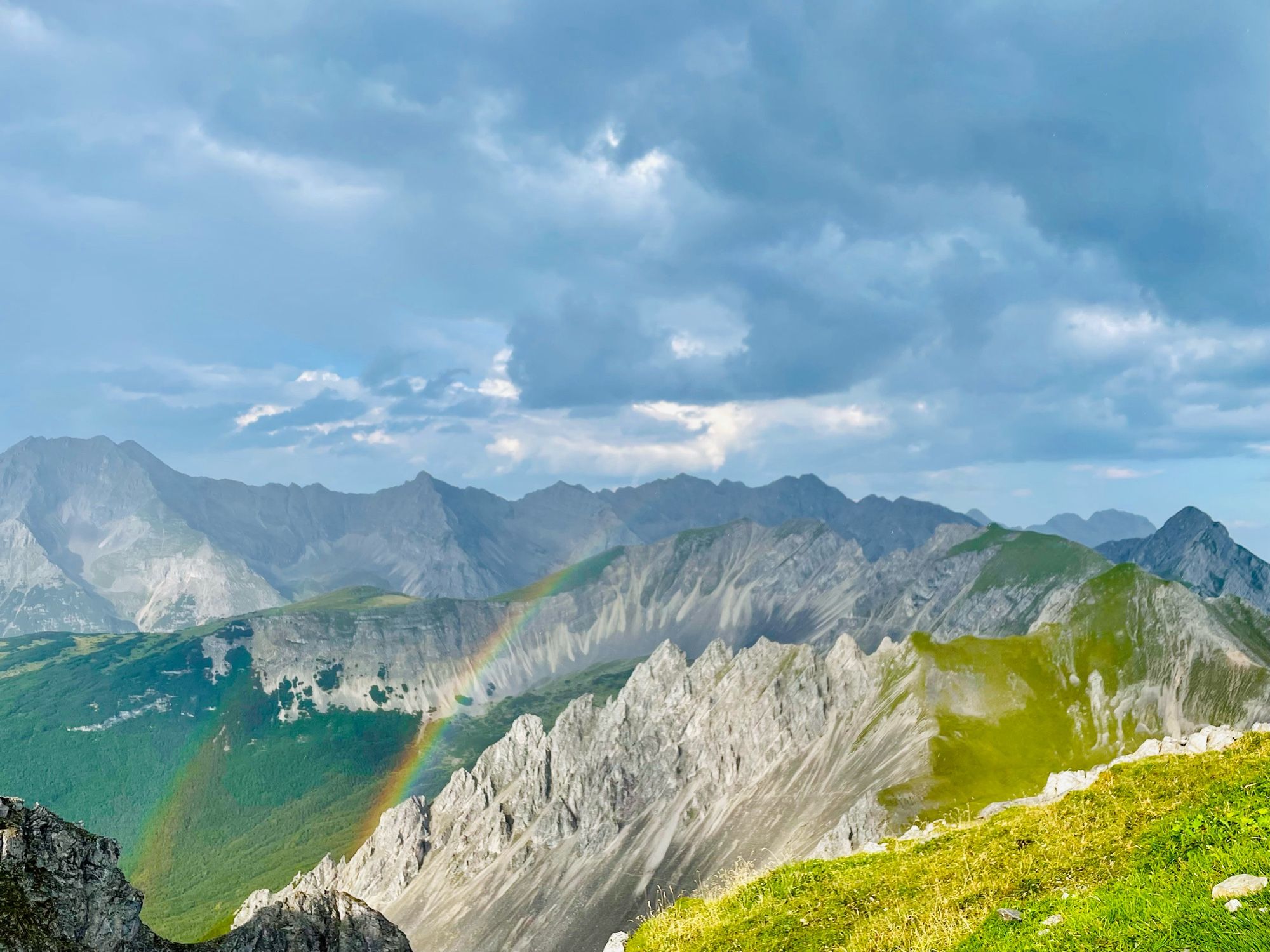 View from the walkway of the mountain. A rainbow appeared over the top of the mountain after it rained.