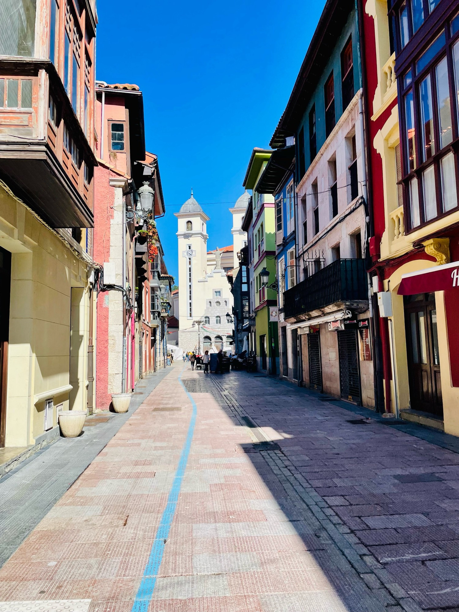 Multicoloured buildings in a street in the Old Quarter.