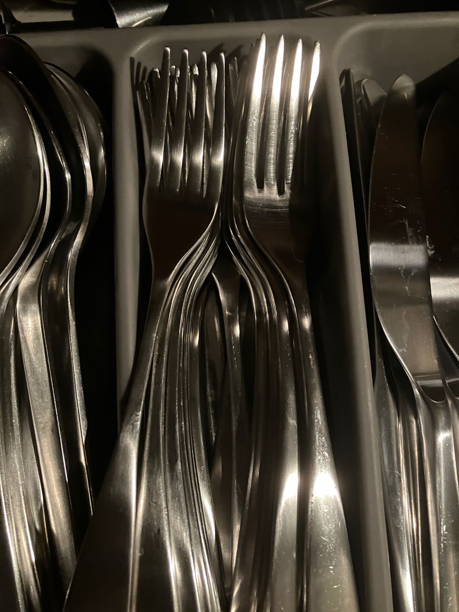 Forks are sorted in the tray into big and little