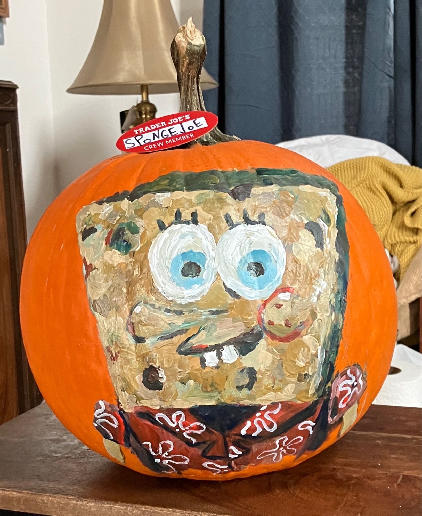 SpongeBob painted on a pumpkin wearing Trader Joe’s uniform (red and white Hawaiian shirt)