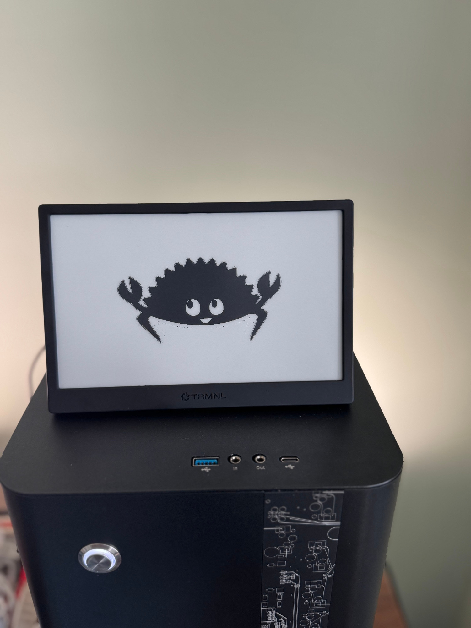 Picture of a TRMNL display showing a picture of ferris