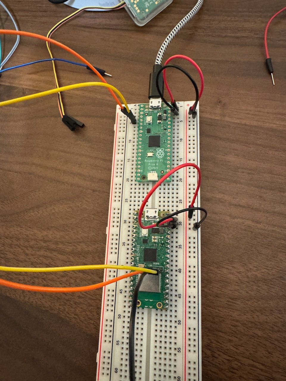 2 picos on a breadboard configured with the top being a probe and bottom being the target