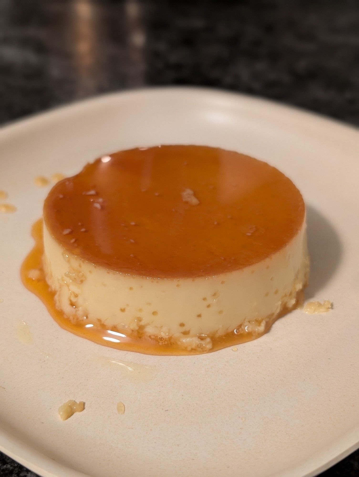 A flan, a custard with a glossy caramel top. Also known as a crème caramel in some European countries.