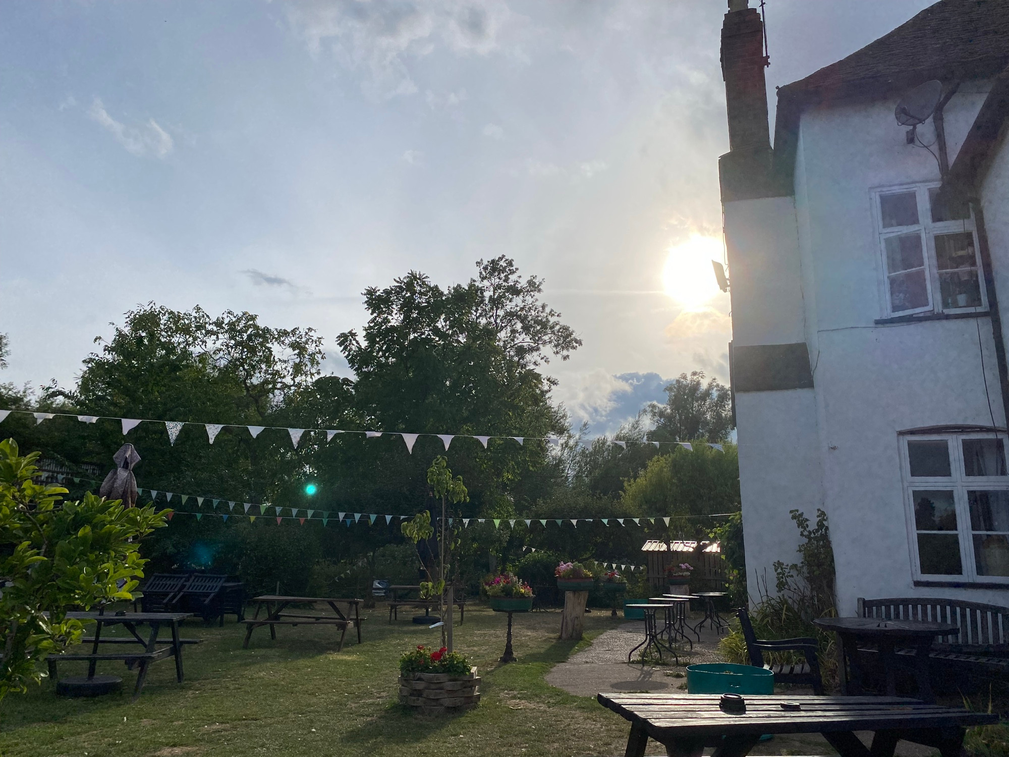 Country pub, garden, bunting, sunset