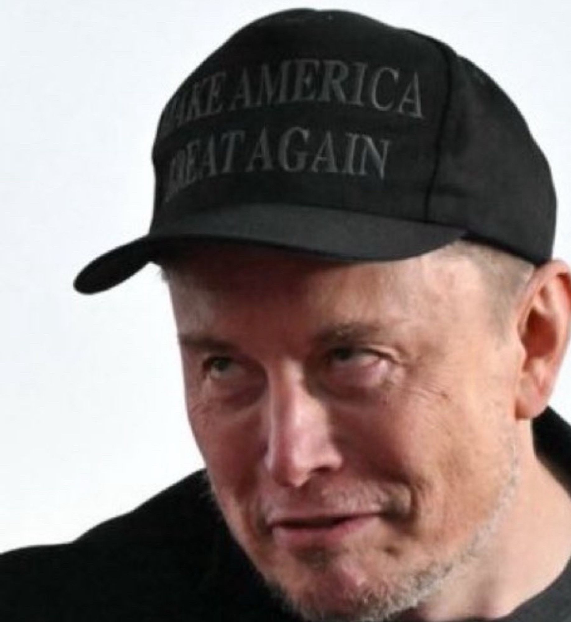 Elon Musk looking like Ed Gein at Trump rally