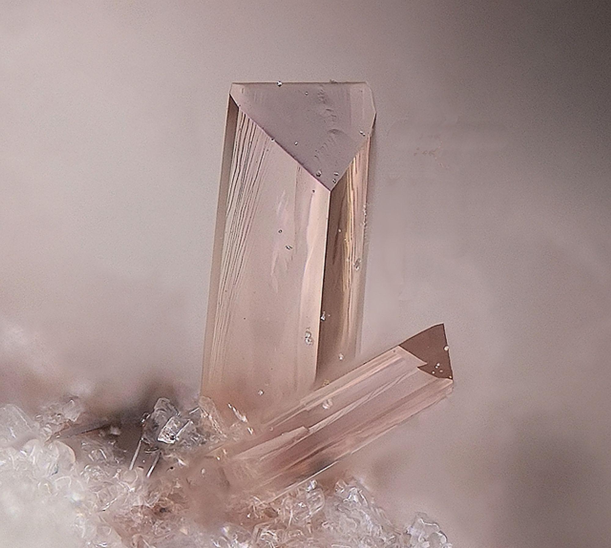 Gemmy, champagne-colored prisms of Mullite. Image from mindat.org.