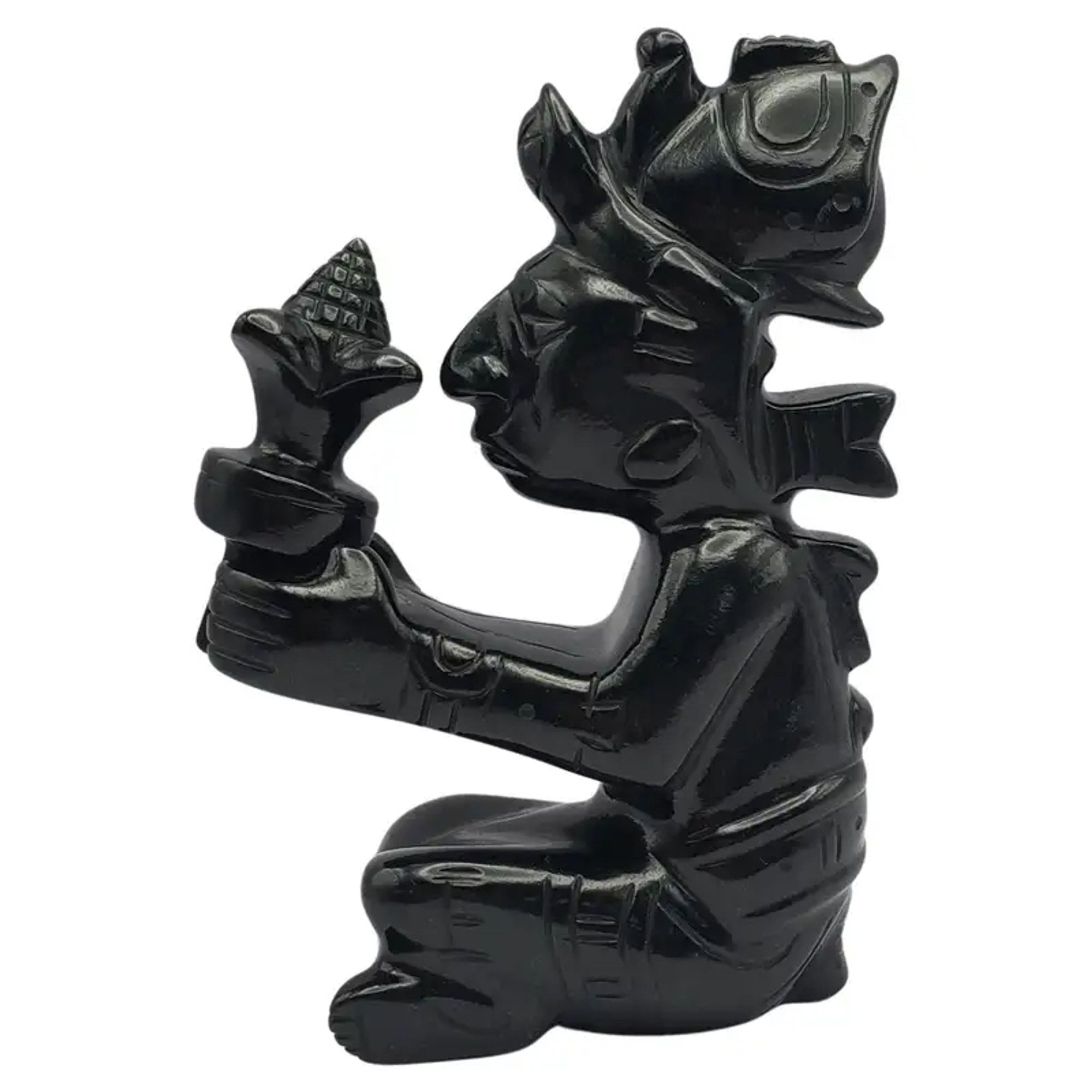 Black jade carving of a Mayan figure holding a bouquet of maize. Image from 1stDibs.com