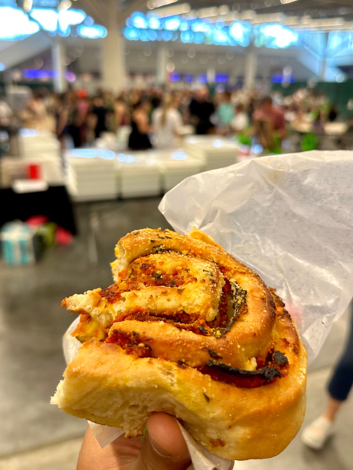 Pepperoni roll from Cleveland Vegan with convention center in the background