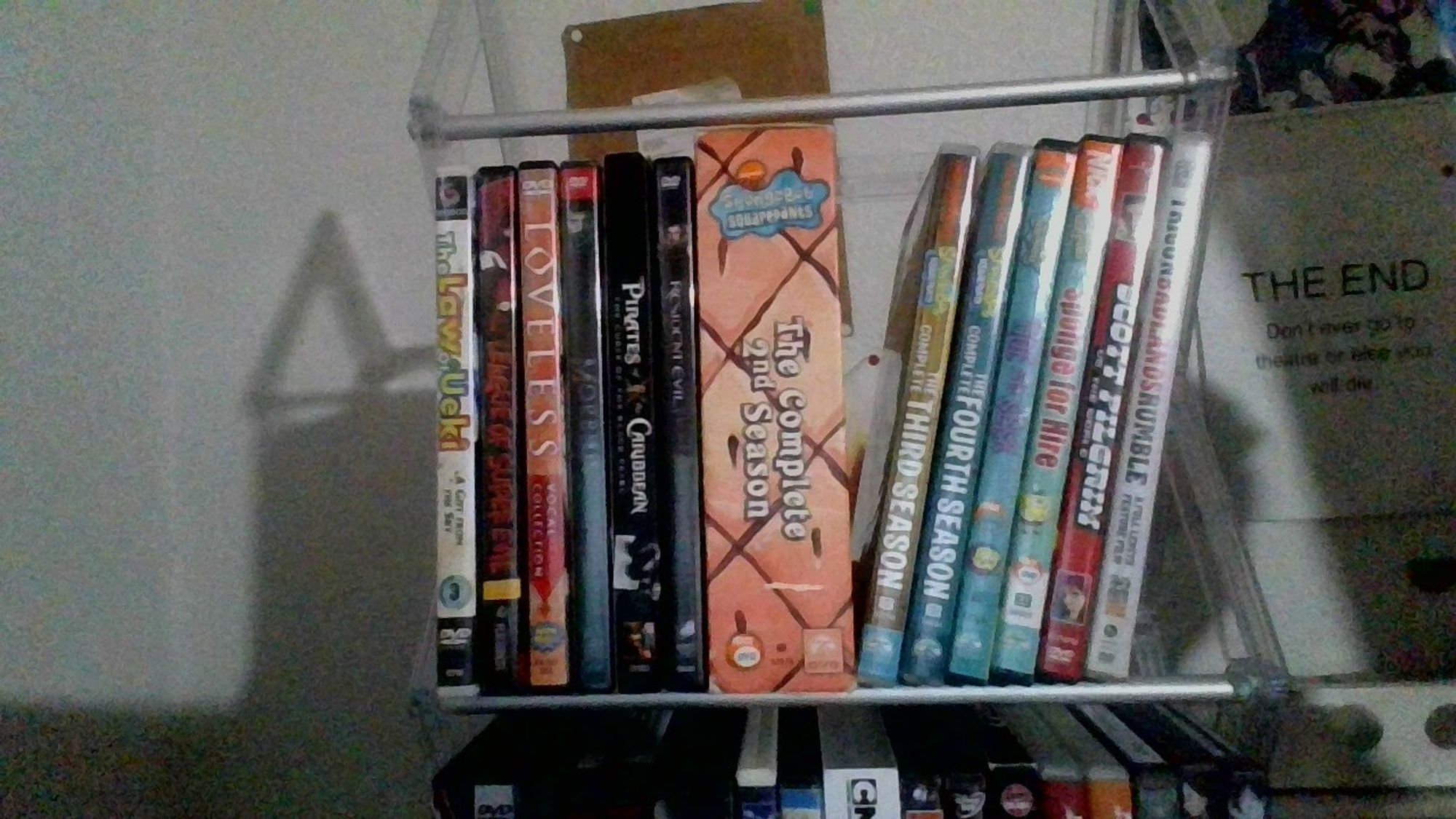 The second shelf of my DVD collection.
The Law of Ueki Volume 3 - A Gift from the Sky
League of Super Evil Season 1, Volume 1
Loveless - Vocal Collection
Morbius
Pirates of the Caribbean: Curse of the Black Pearl 2-Disc Collector's Edition
Resident Evil: The Complete Collection
Spongebob Squarepants The Complete 2nd Seasons
The Complete Third Season
The Complete Fourth Season
Tide and Seek
Sponge For Hire
Scott Pilgrim Vs. The World
Trigun Badlands Rumble