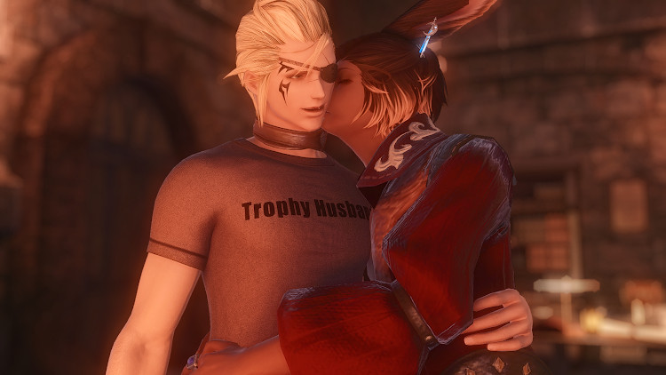 Sasha, a male Viera from Final Fantasy 14, side-hugs Riol Forrest and kisses his cheek.