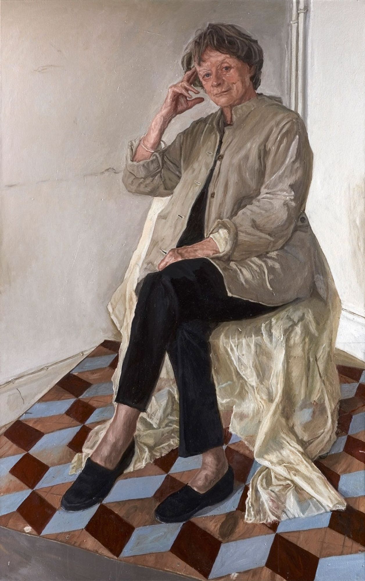 Actress Maggie Smith, in a full-length painted portrait. She sits on a chair or seat covered with a textile, her legs crossed, her feet apparently in slippers, her hand to her temple, a patterned inlaid floor beneath her.