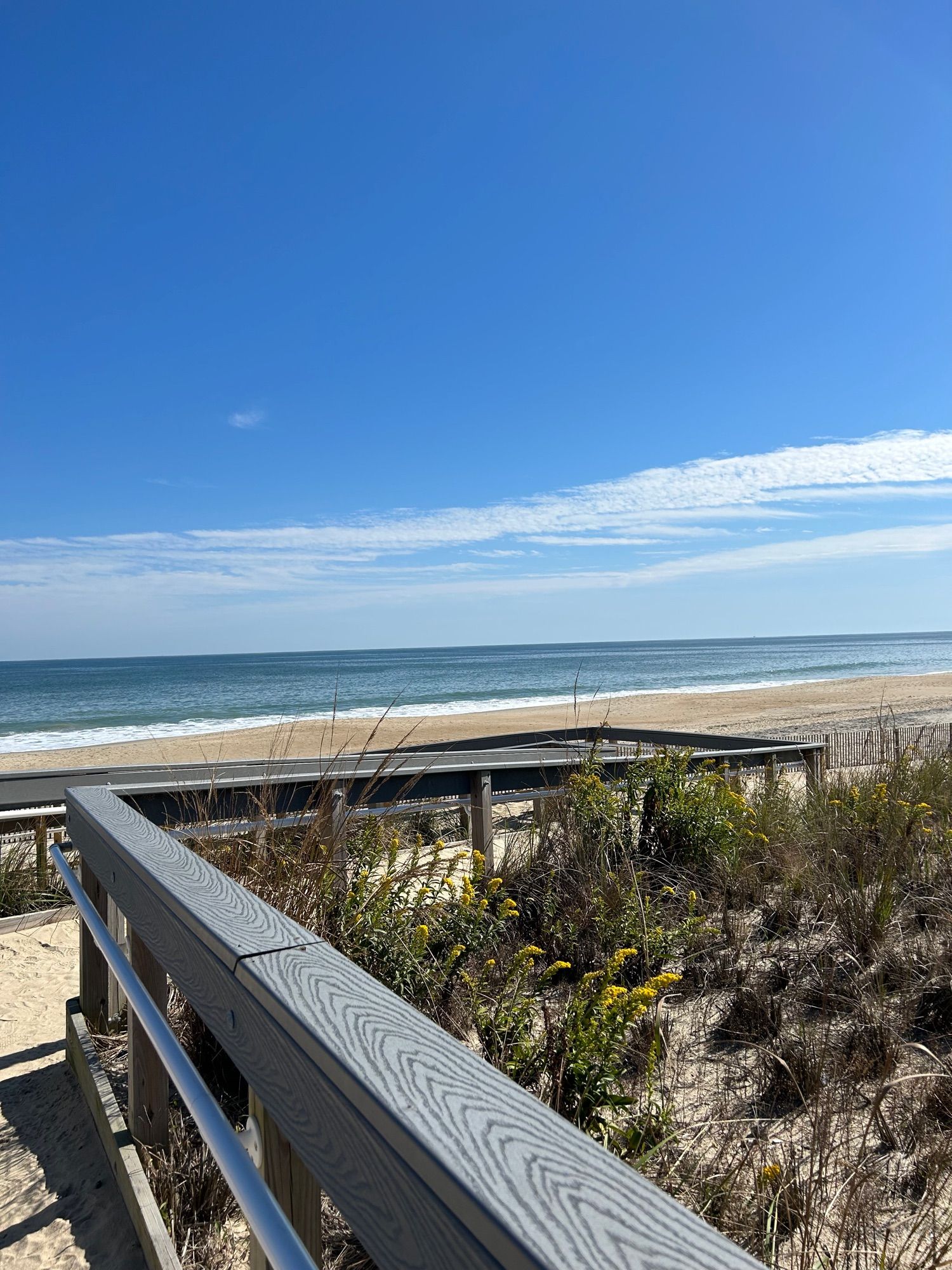 View of water walking down the ramp to the beach