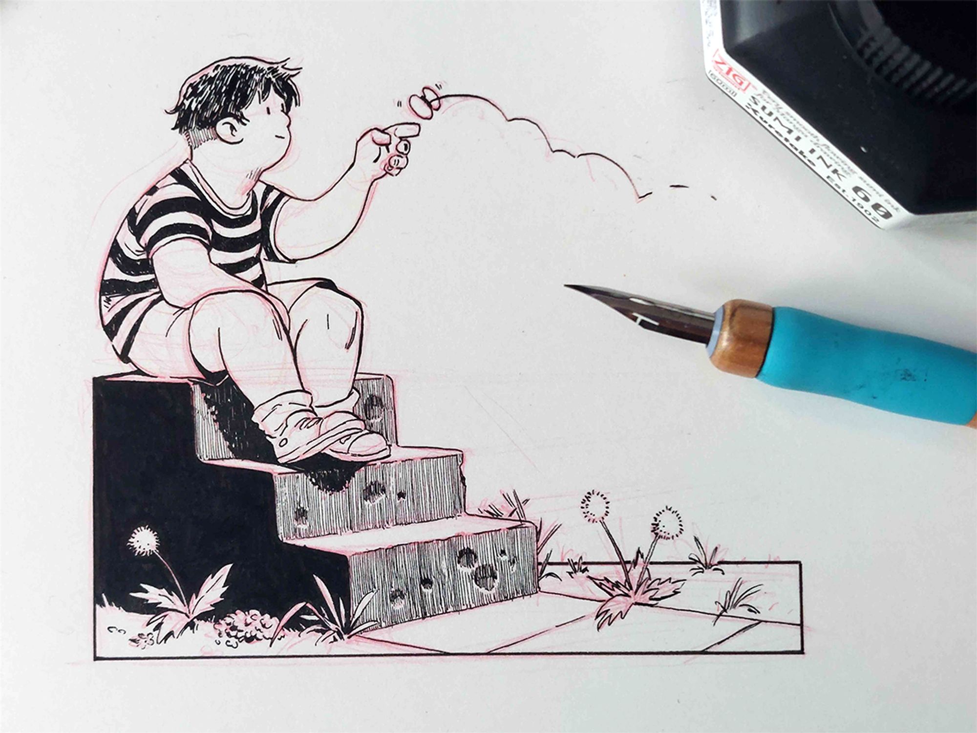 A photo of a traditional ink art piece, the pen nib and ink bottle are visible. The drawing is of a boy sitting on a well worn stair amongst some weeds, tempting a butterfly to land on his finger