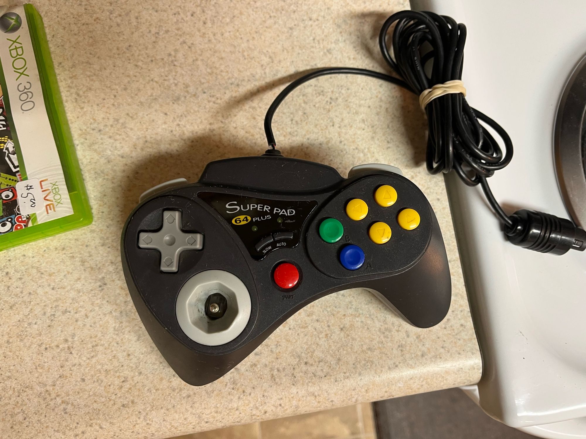 a Super Pad 64 plus controller. it is cursed. the left half of the controller with the dpad and joystick is a giant wedge about twice as thick as the right. the right half with abc buttons is almost shaped like a ps2 grip