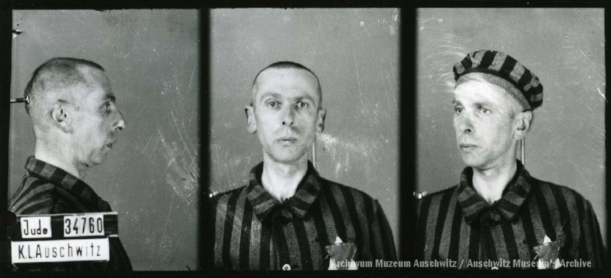 A mugshot registration photograph from Auschwitz. A man with a shaved head wearing a striped uniform photographed in three positions (profile and front with bare head and a photo with a slightly turned head with a hat on). The prisoner number is visible on a marking board on the left.