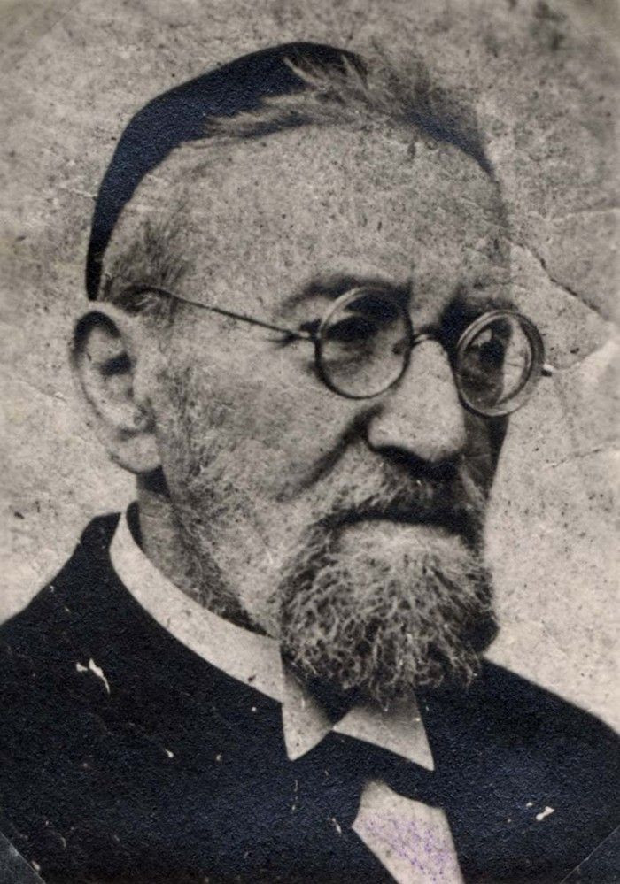 Vintage black and white portrait of a man wearing glasses