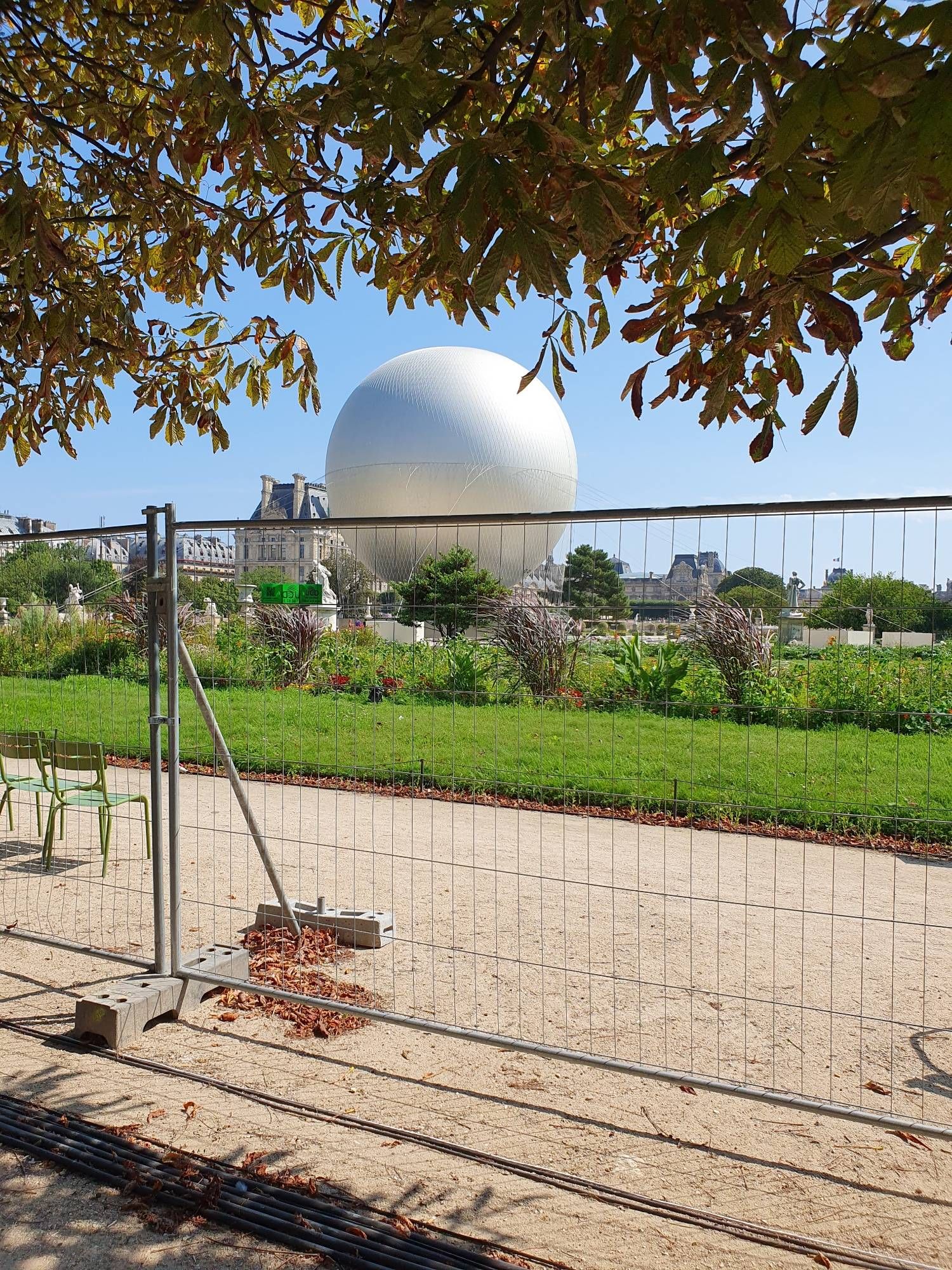 The Paris 2024 balloon on the ground in the Tuileries Gardens