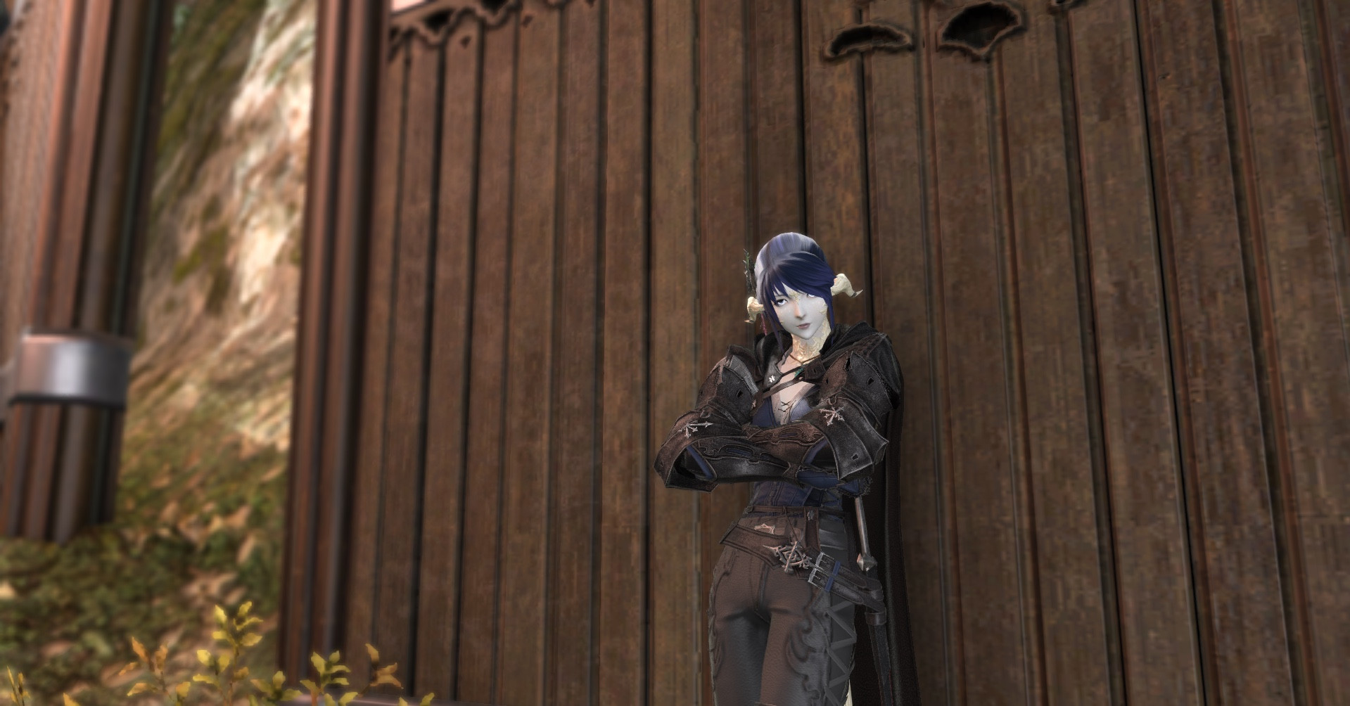 Female au ra with blue hair wearing the ffxvi crossover armor posted up against the wall. The Clive armor was very handsome on her. 