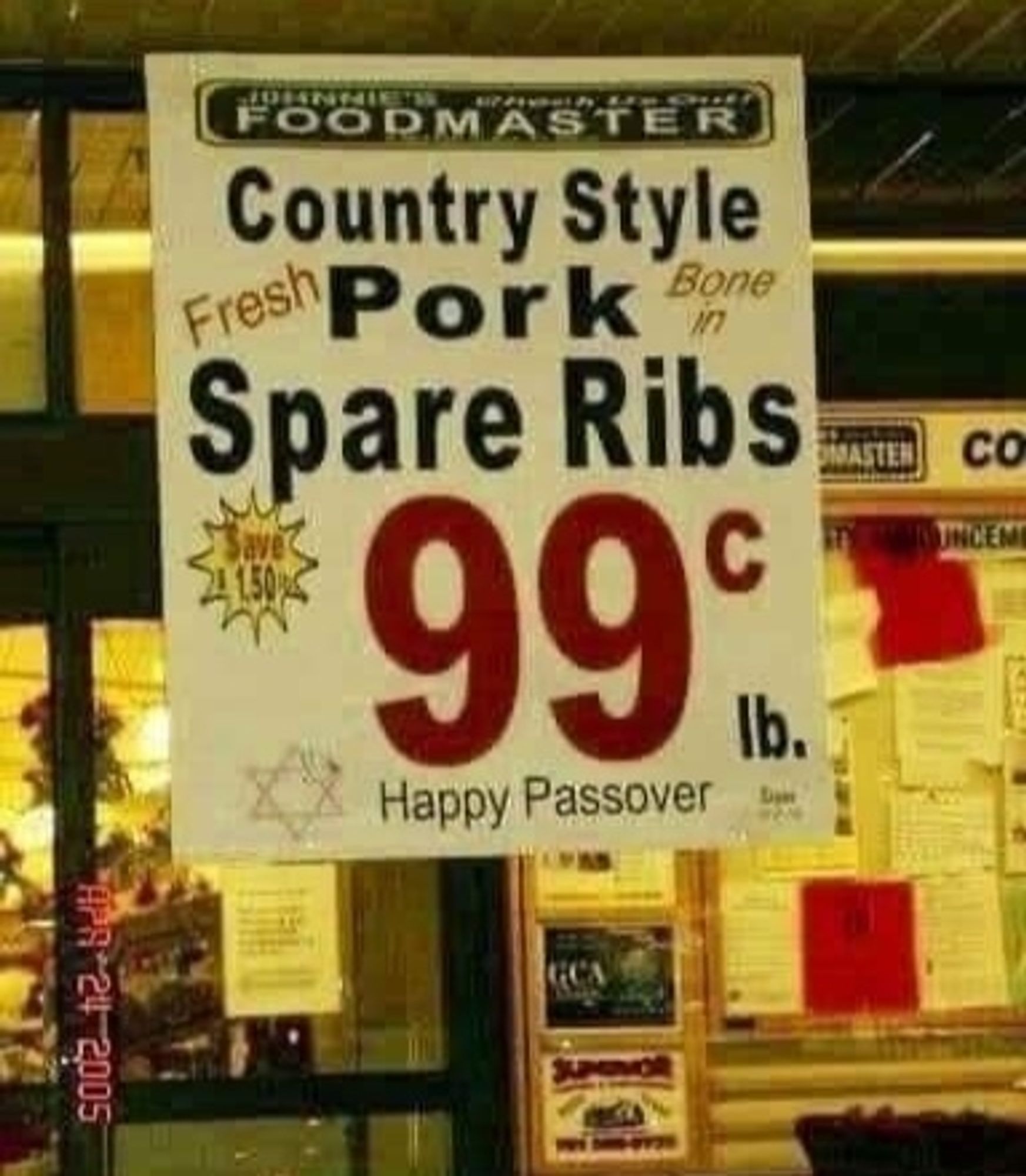 Sign outside a store from Foodmaster, advertising "Country Style Pork Spare Ribs". Below is a Star of David and "Happy Passover"

(Photo dated 2005, so don't get excited about the price)