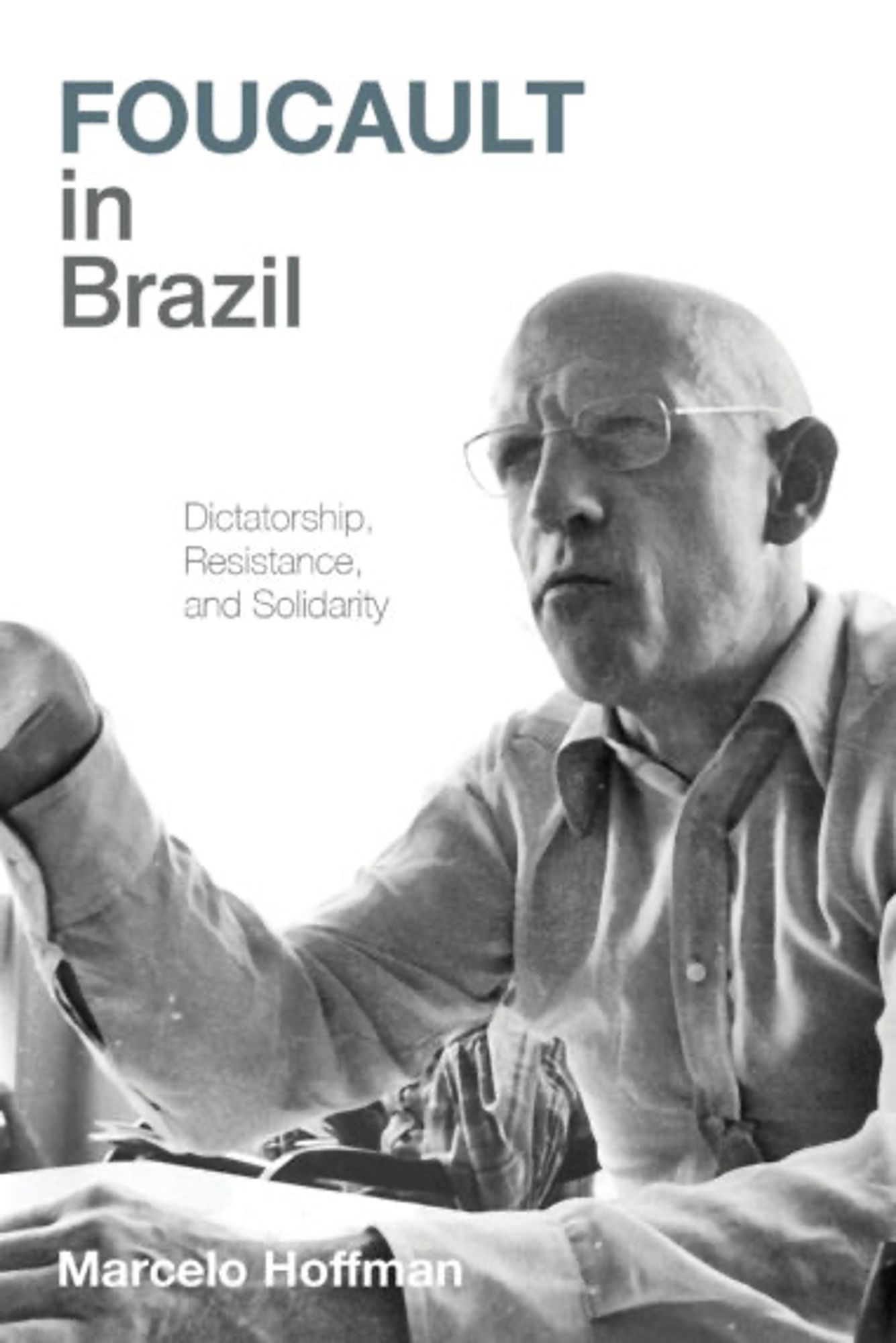 Cover of Foucault in Brazil, with a photograph of Foucault wearing a light coloured shirt