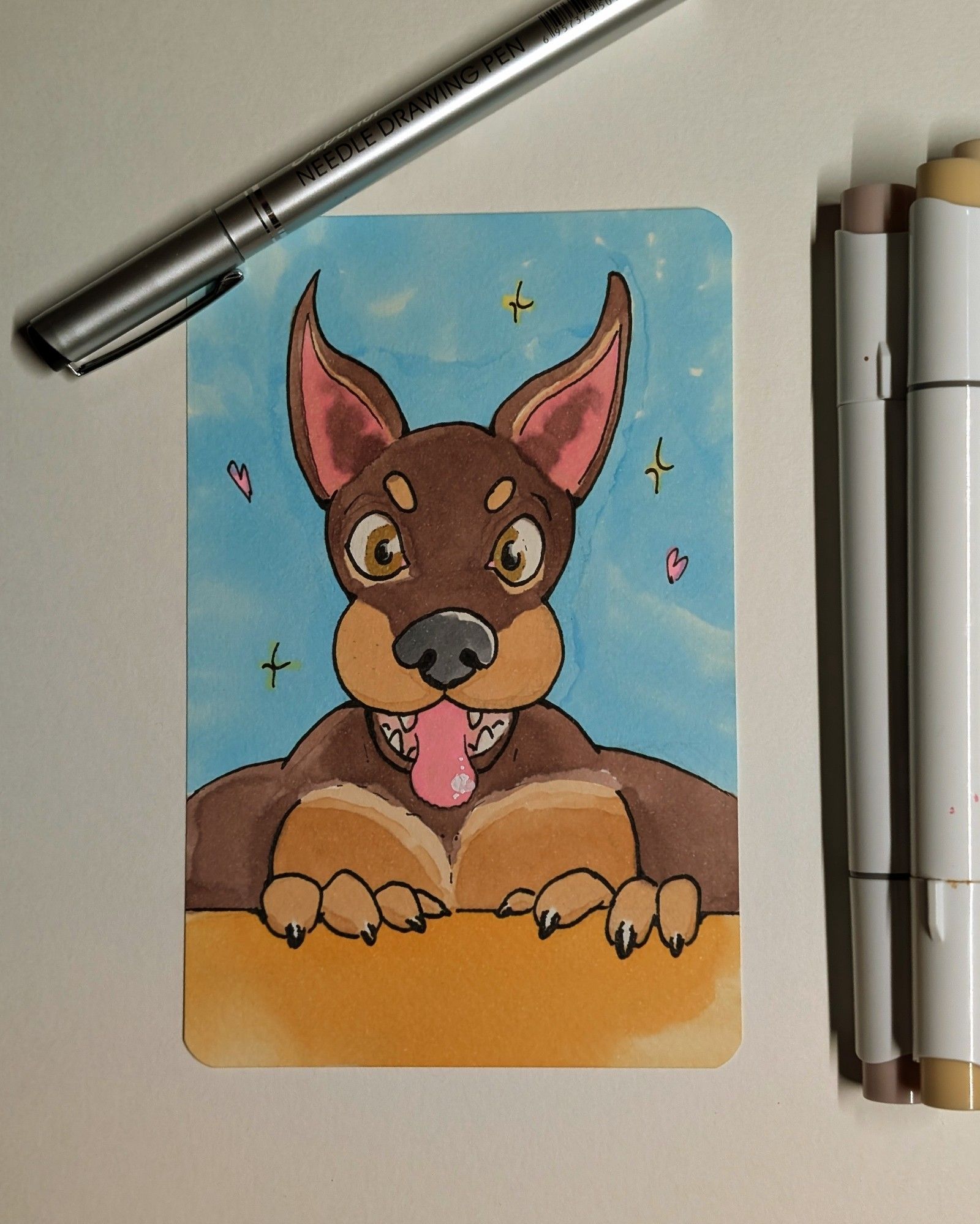 bust drawing of an anthropomorphic buff doberman looking at you chest-height gleefully over a wall.  Expanded shot showing the pen and marker used to draw it