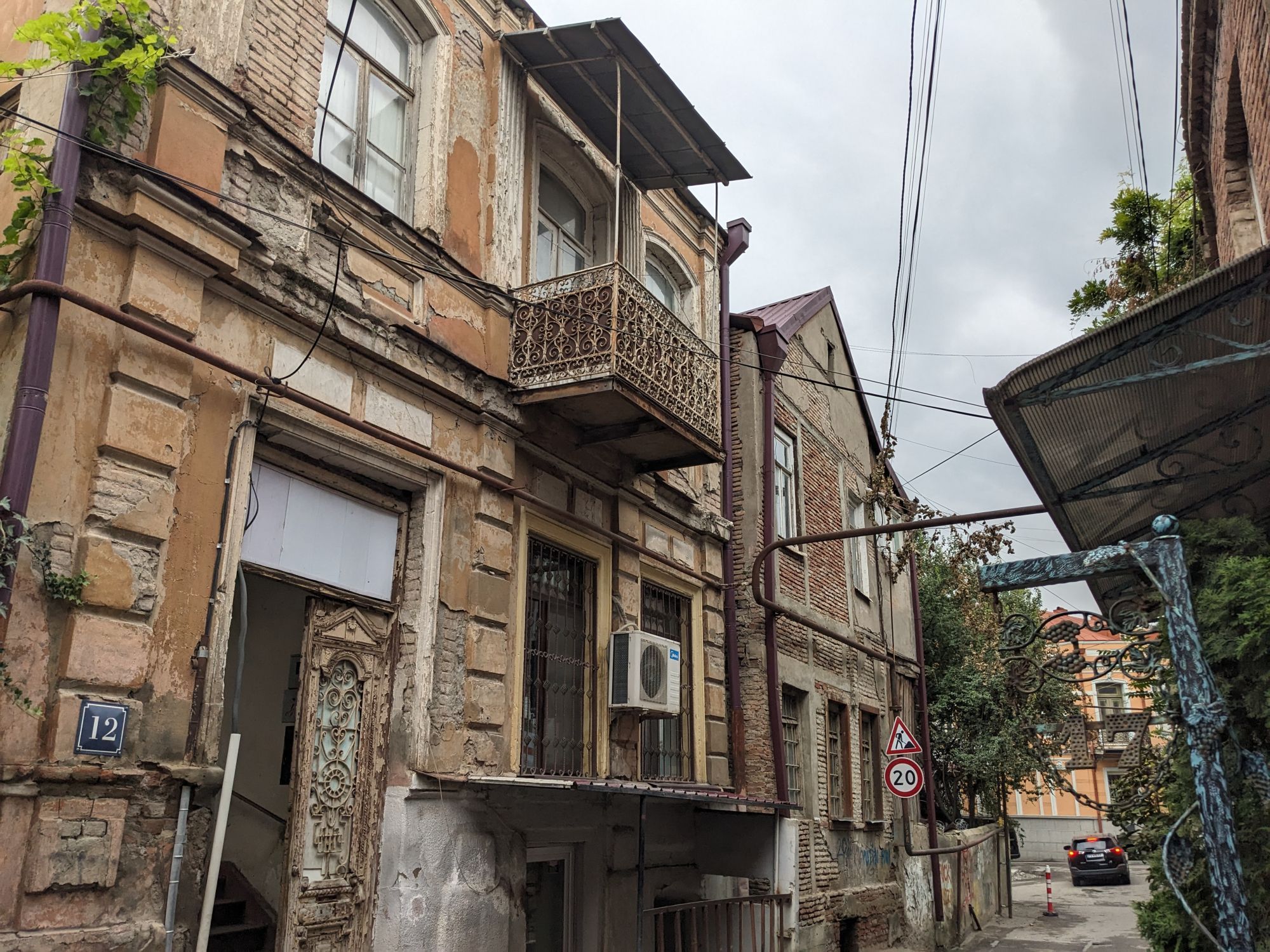 A view of Old Tbilisi, Georgia, with run-down but interesting buildings, some with characteristic balconies