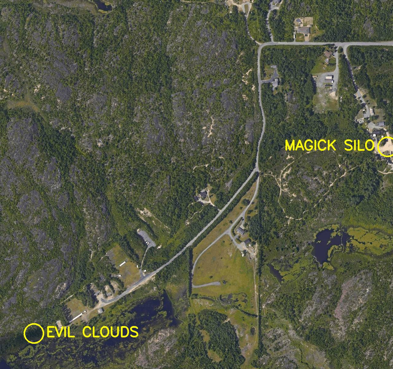 Aerial satellite photo labelled in bright yellow letters: 

1. Magick Silo
2. Evil Clouds