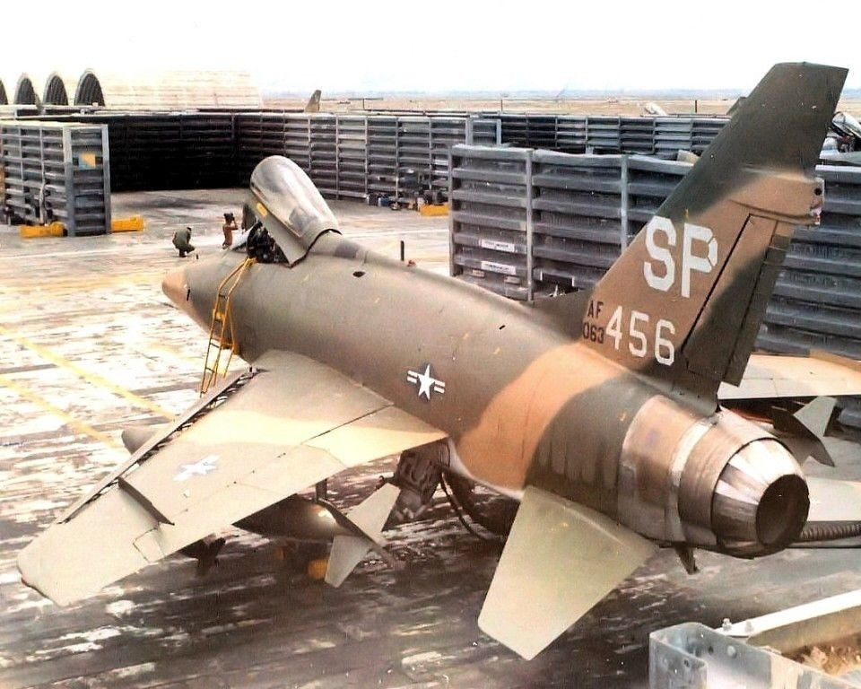 Camouflaged F-100D Super Sabre in its revetment at Tuy Hoa during the Vietnam conflict.