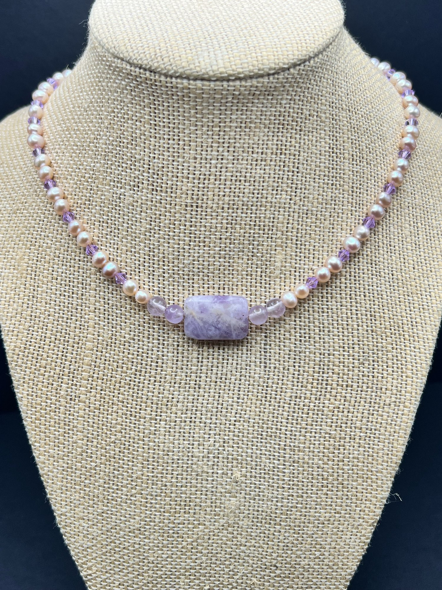 A crystal beaded choker made with lavender moon quartz, amethyst & pearls. Accented with Swarovski Czech glass in lilac