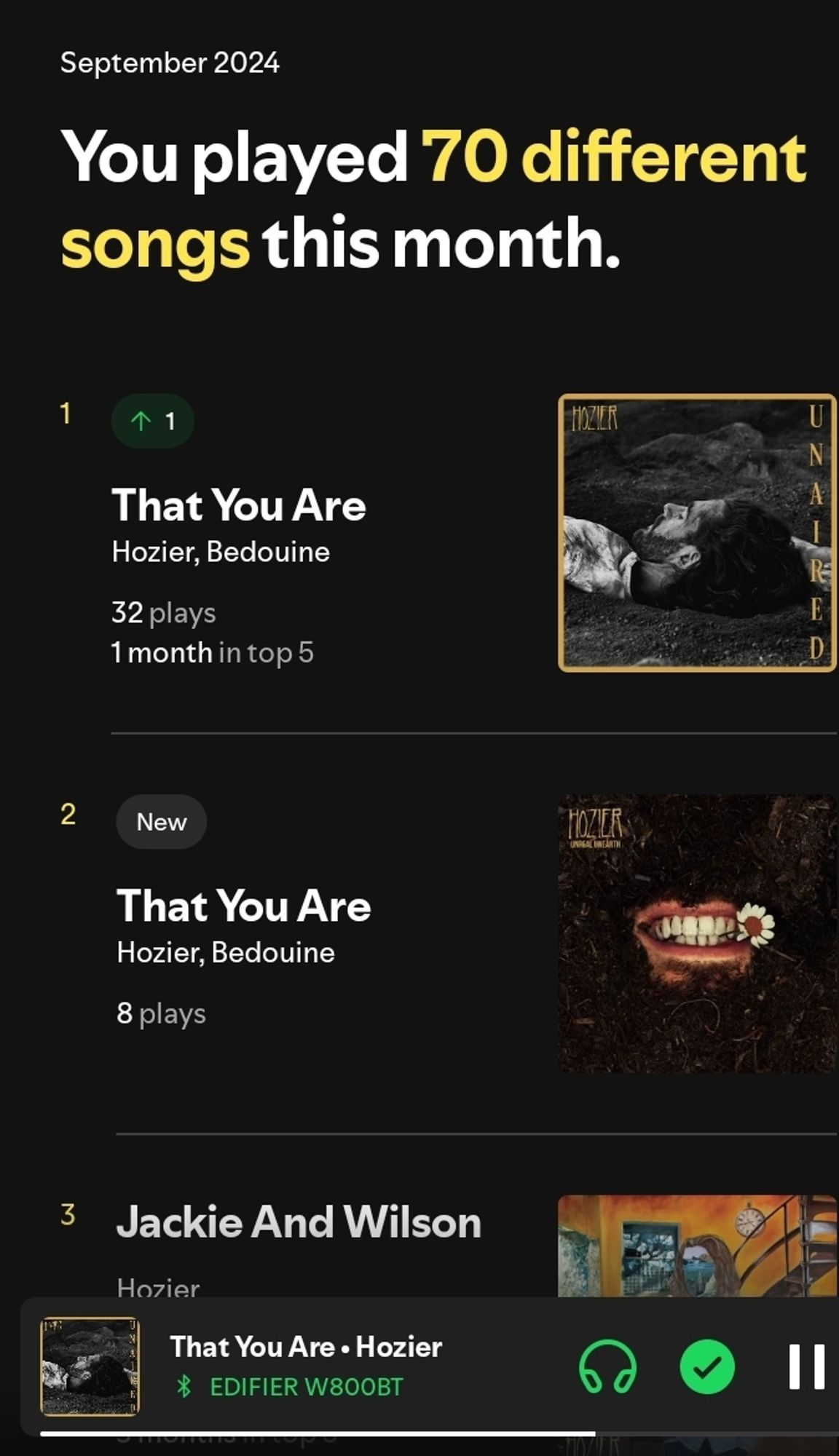 screenshot do aplicativo Spotify mostrando as músicas mais ouvidas do mês. 
a primeira: that you are, do hozier (imagem da capa do EP)
a segunda: that you are, do hozier (imagem  da capa do álbum)
a terceira: jackie and wilson, do hozier
abaixo, o player mostra estar tocando that you are