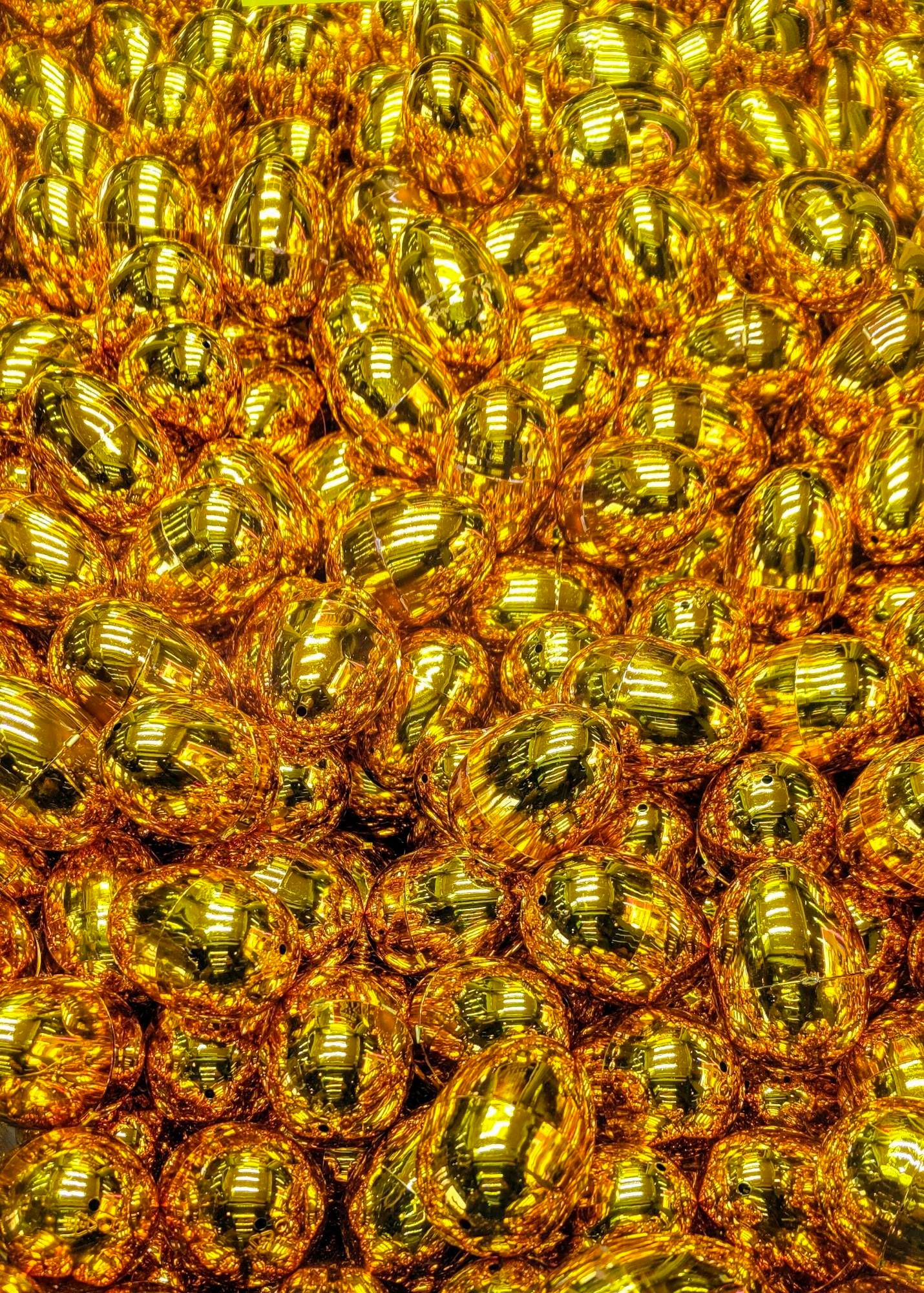 Gold coloured plastic eggs in a grab machine