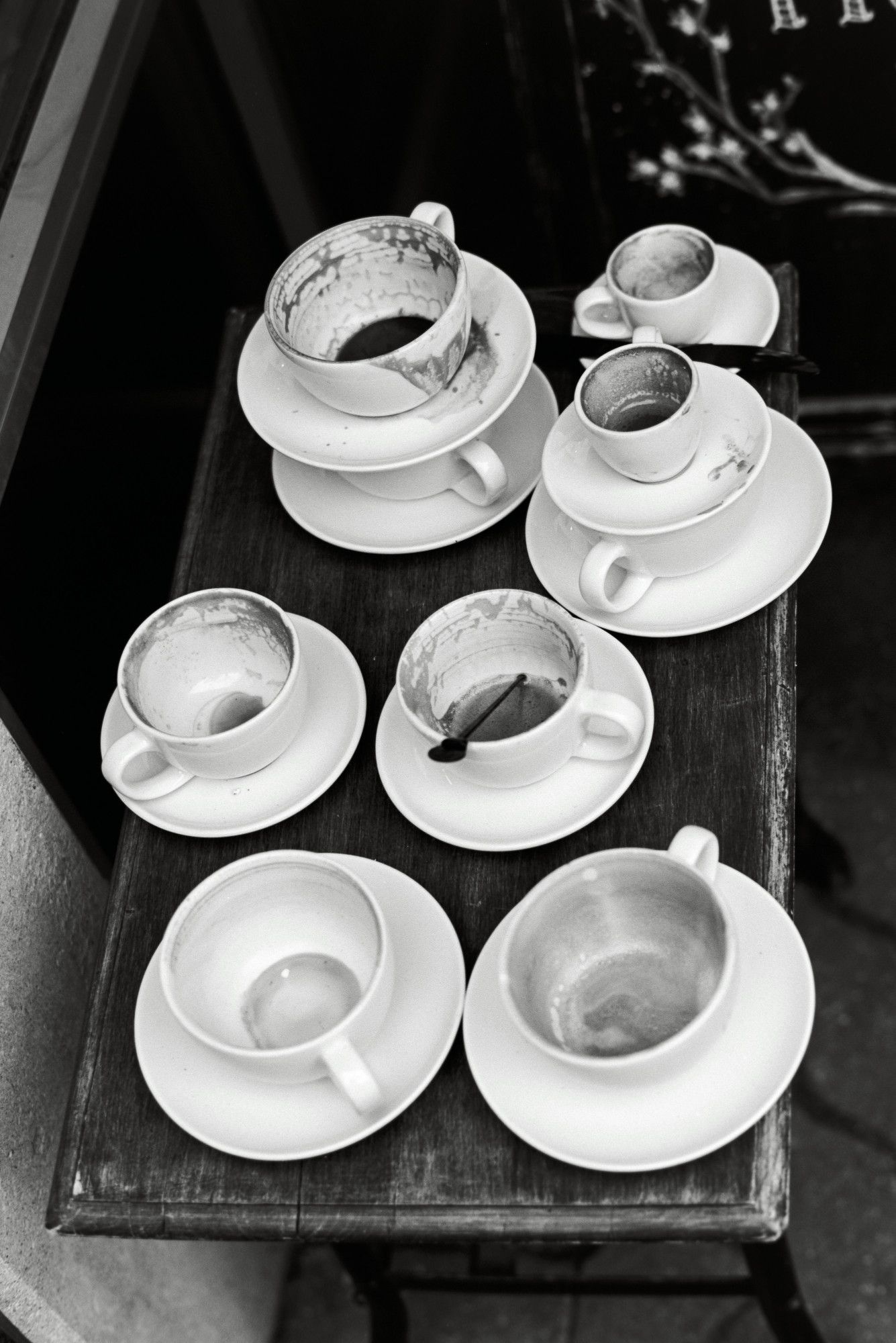 Empty coffee cups outside a cafe