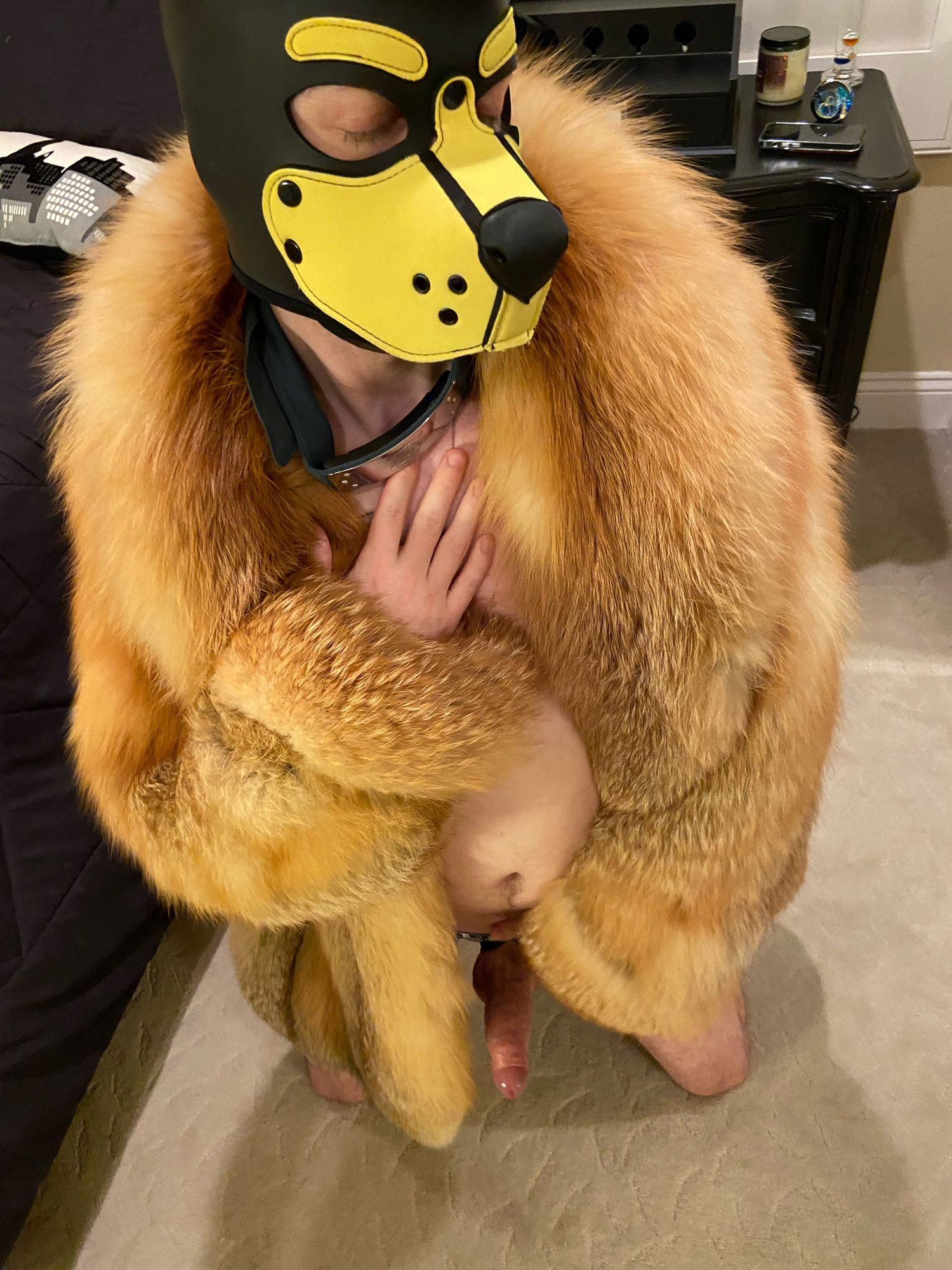 Human puppy naked on knees in red fox fur coat