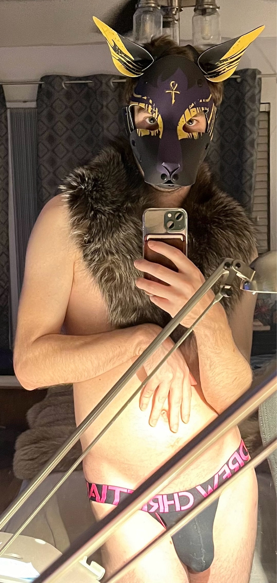 Mirror selfie of Anubis human pup wearing silver fox fur collar and black & pink jock