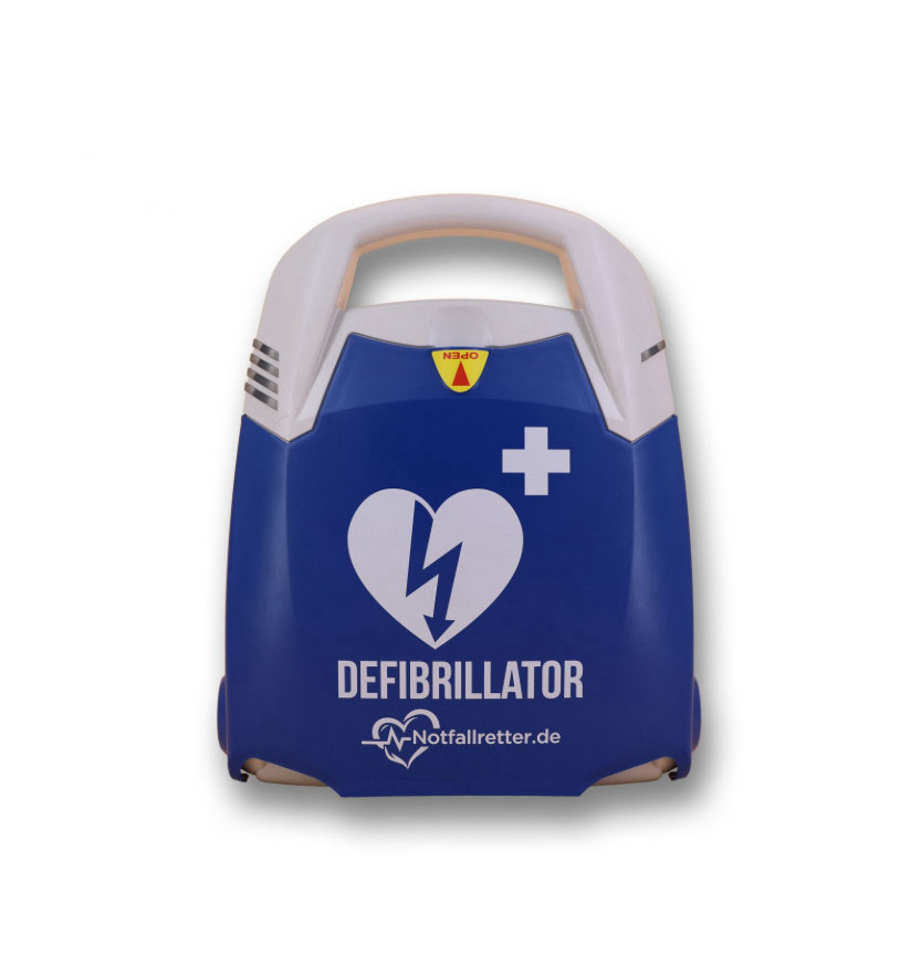 Ein Defibrillator in einer blauen Plastikverpackung. Darauf abgebildet in der Mitte ein weißes Herz mit einem Blitz , rechts darüber ein weißes Kreuz, unten die Beschriftung „Defibrillator“.