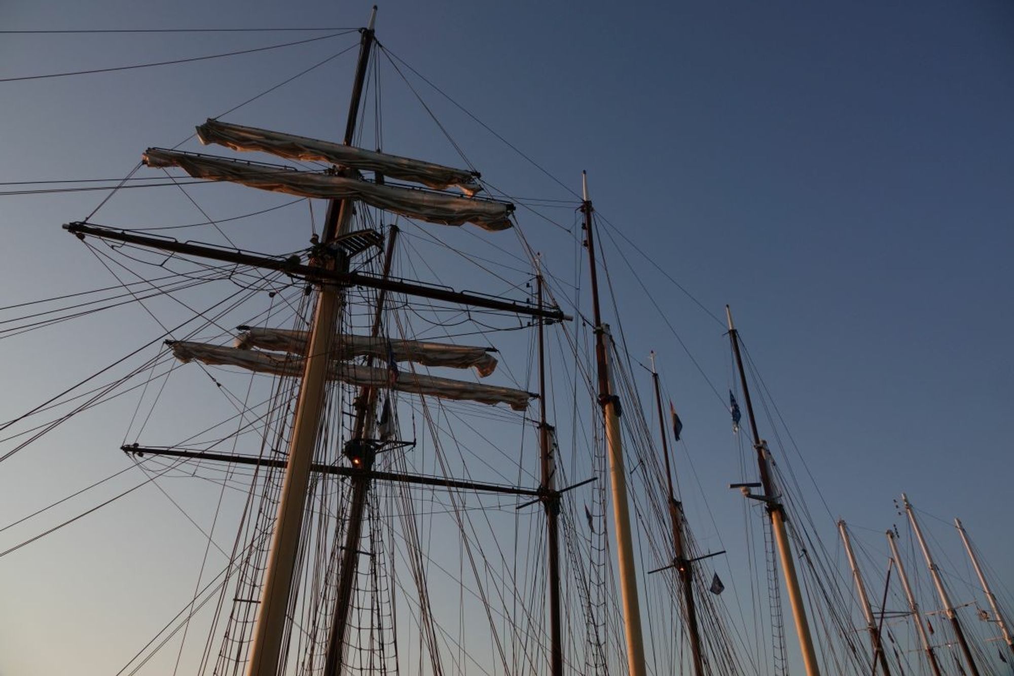 masts of big old sailing ships