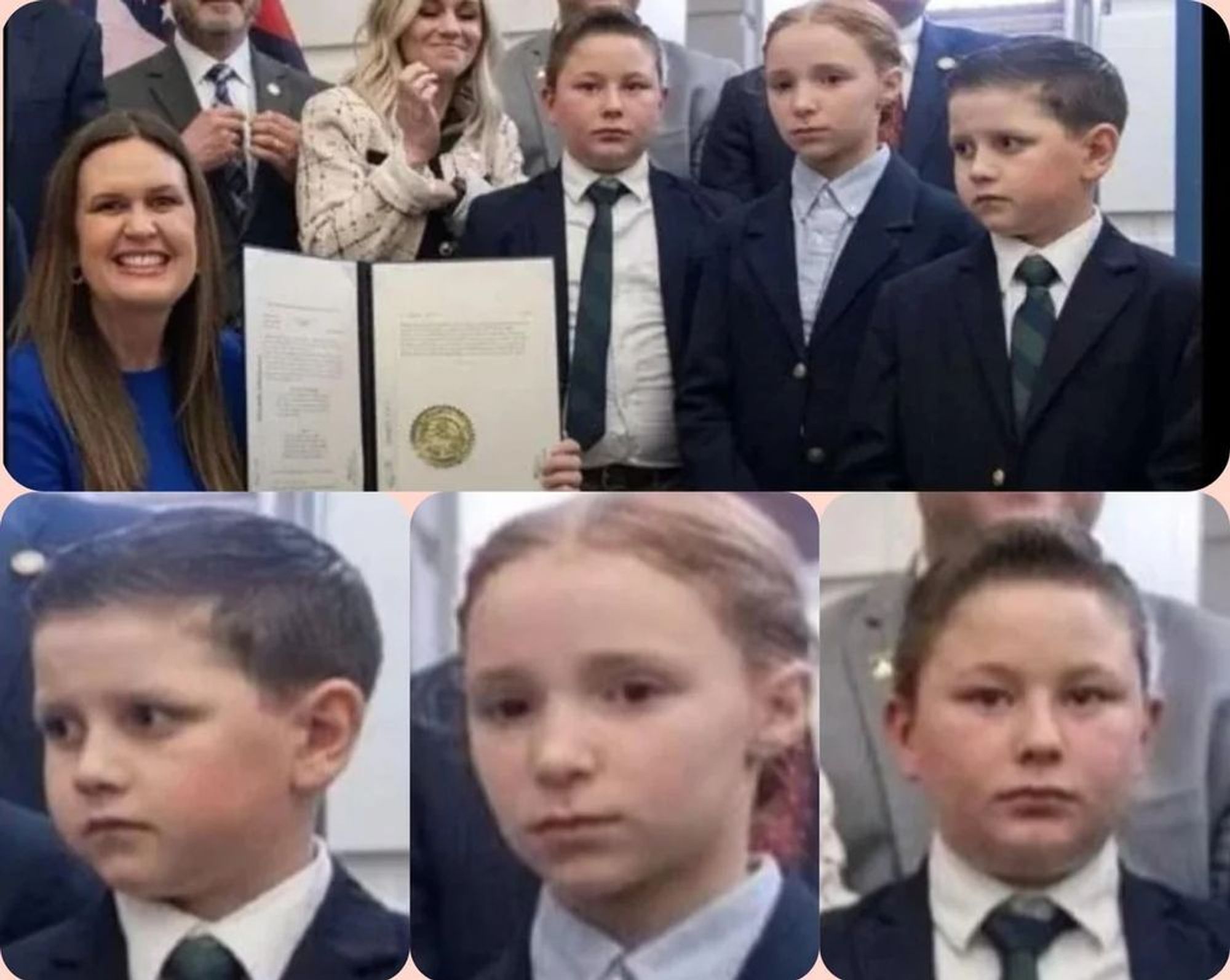 sarah huckabee sanders signing a law with three unhappy looking kids in the background.