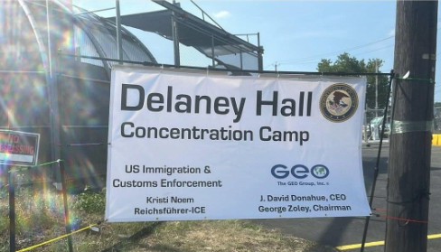 Sign: Delaney Hall Concentration Camp  US Immigration & Customs Enforcement / Kristi Noem Reichsfuhrer-ICE  GEO Zoley Chairman 
