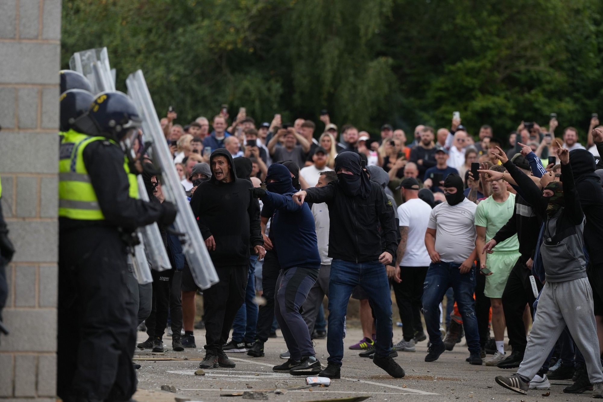 A photo of clashes between police and far-right groups during an attack on a Holiday Inn Express in Rotherham, South Yorkshire, United Kingdom on August 4, 2024. Credit: Anadolu via Reuters Connect