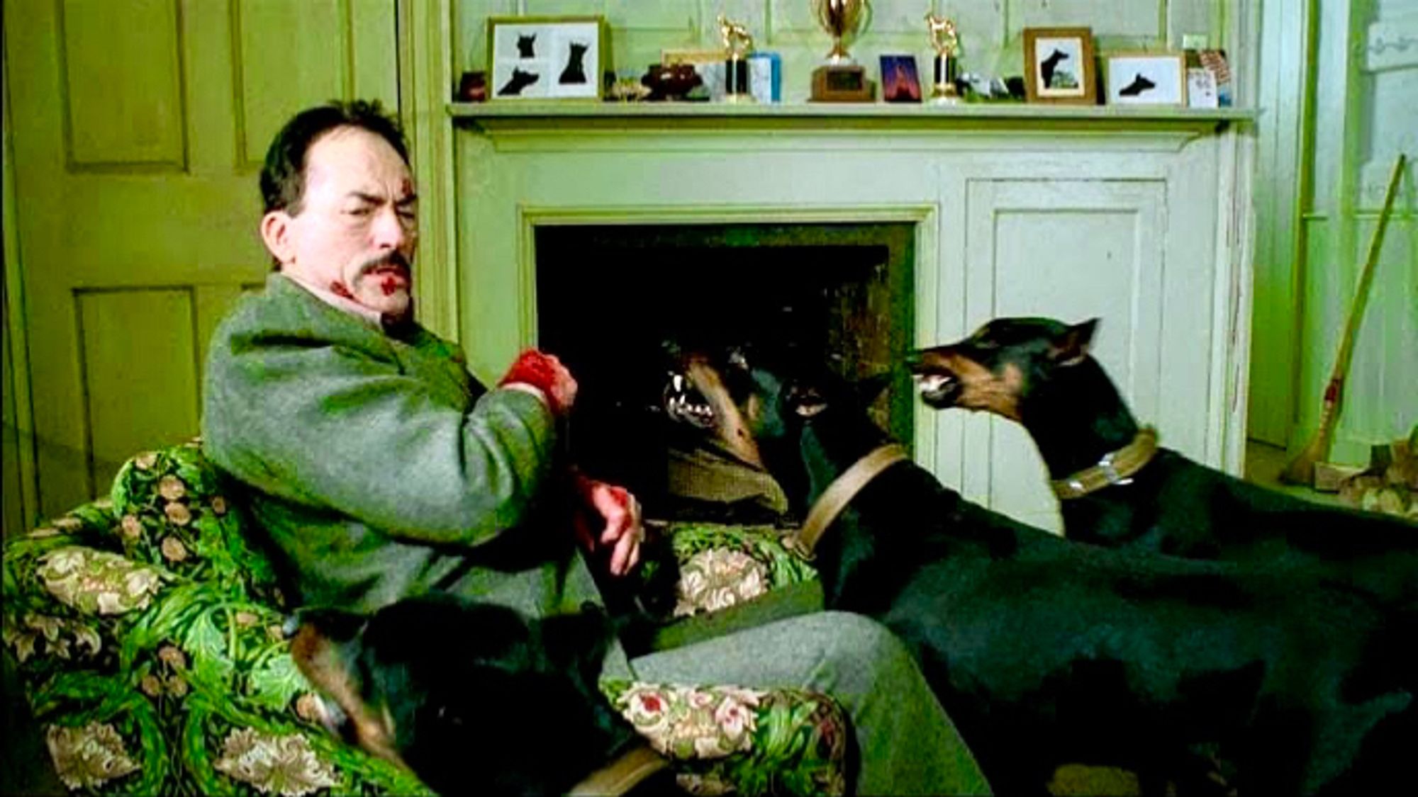 Gregory Peck as Dr Mengele in The Boys from Brazil, being menaced by dobermans.