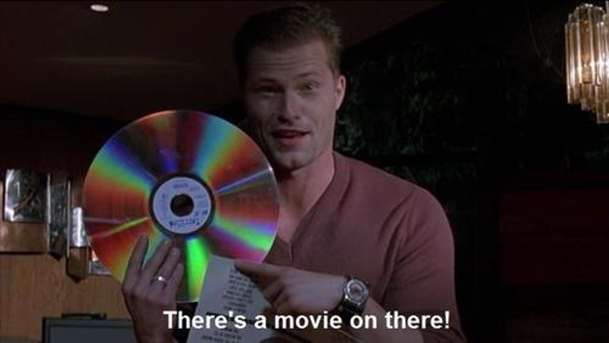 Til Schweiger holding up a laser disc and pointing at it while saying, There's a movie on there!"